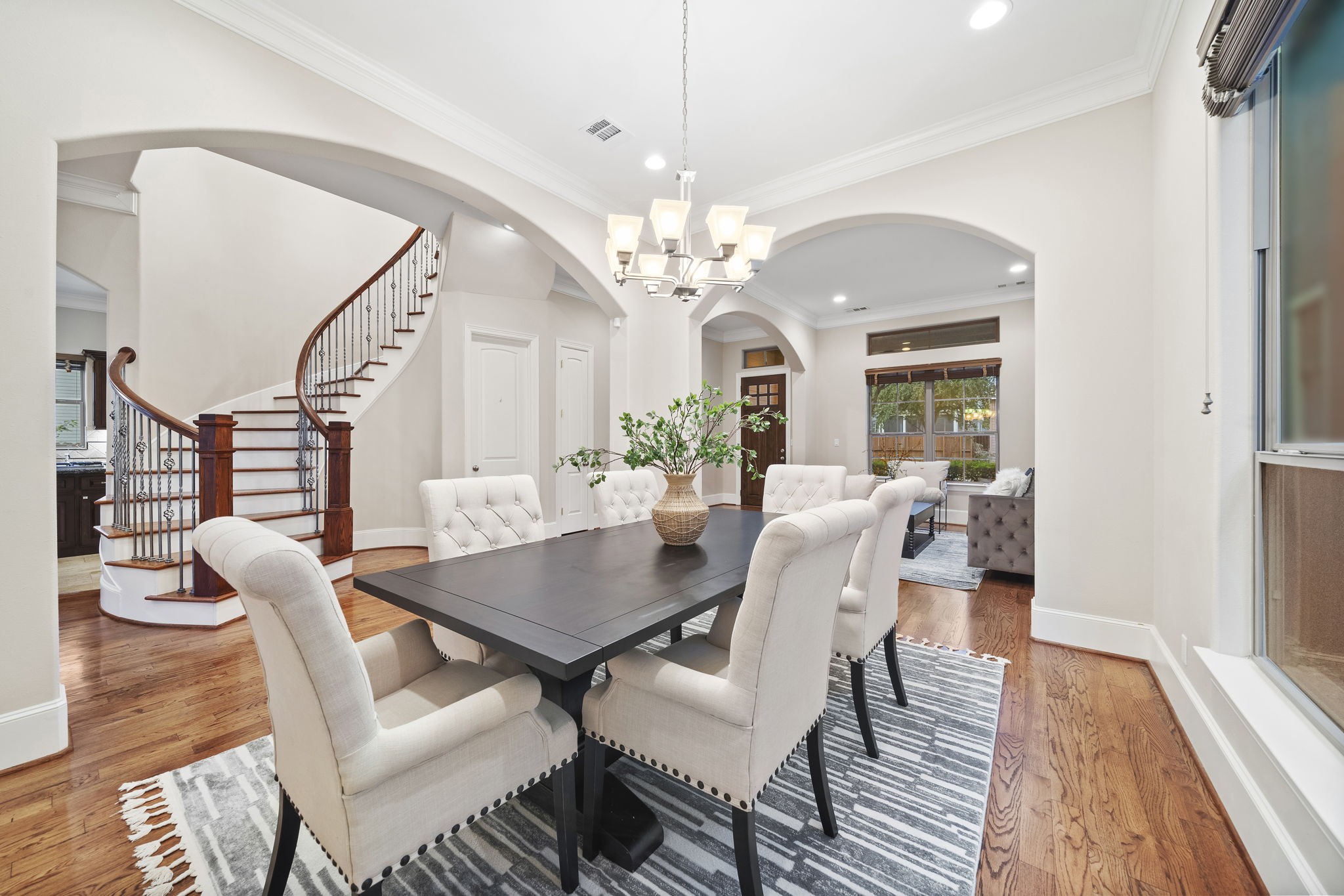 The formal dining room is bathed in natural light and presents the perfect spot to seat a large group of guests, all while leaving ample space to move around.