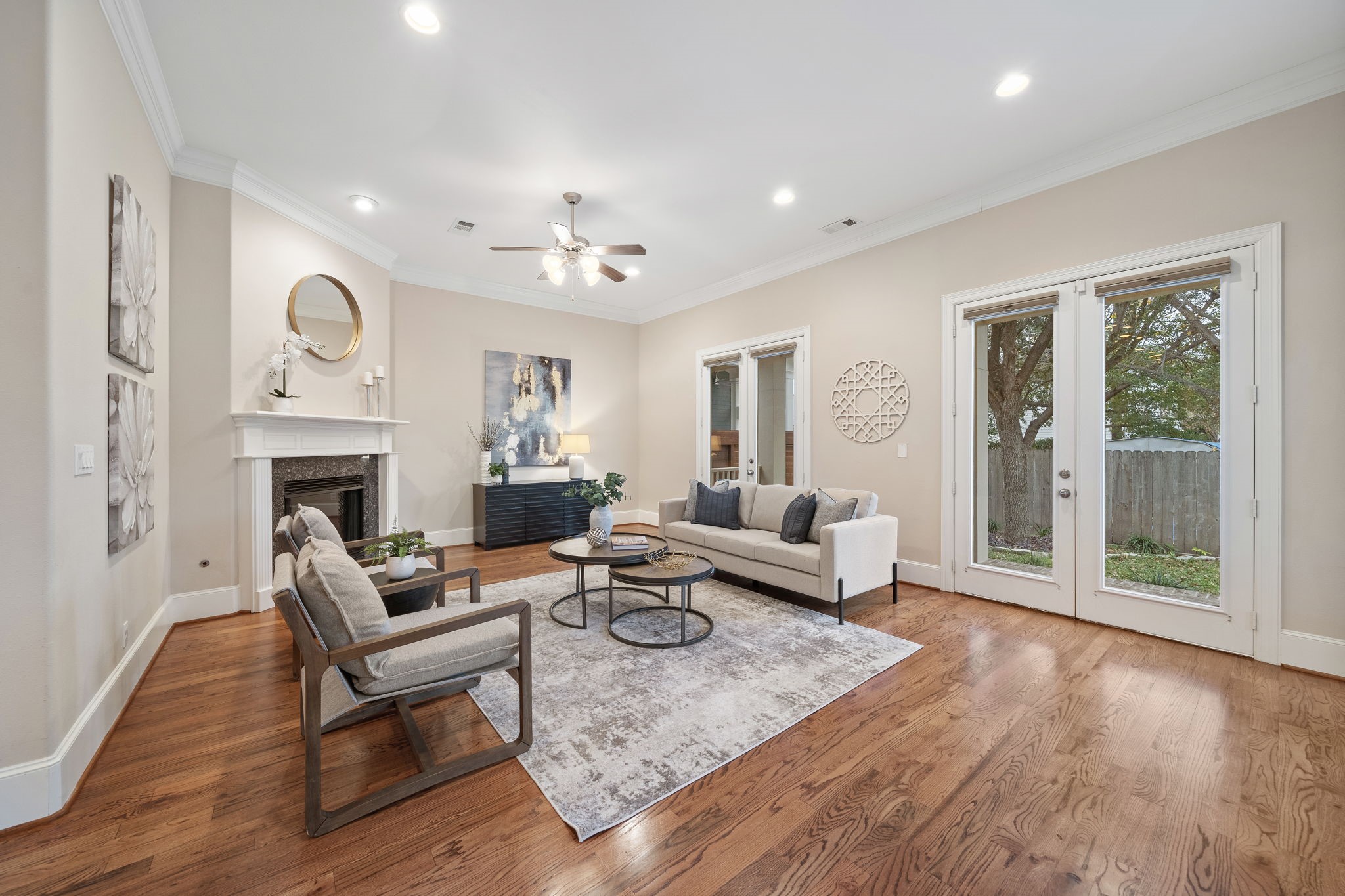 Leave guests in awe as they gather in the living room flaunting a stately gas log fireplace, high ceilings, abundant floor space, and convenient access to the private backyard.