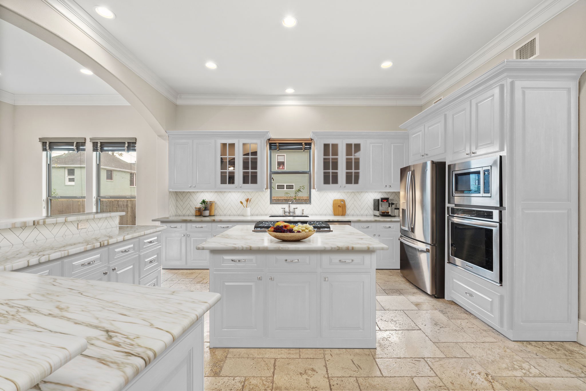 This is a virtual image to show the kitchen if you wanted to paint the cabinets white and replace the countertops and backsplash.