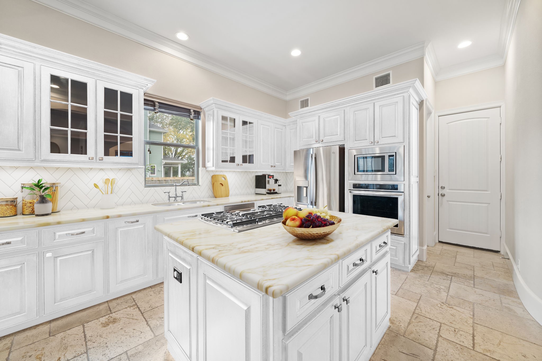 This is a virtual image to show the kitchen if you wanted to paint the cabinets white and replace the countertops and backsplash.