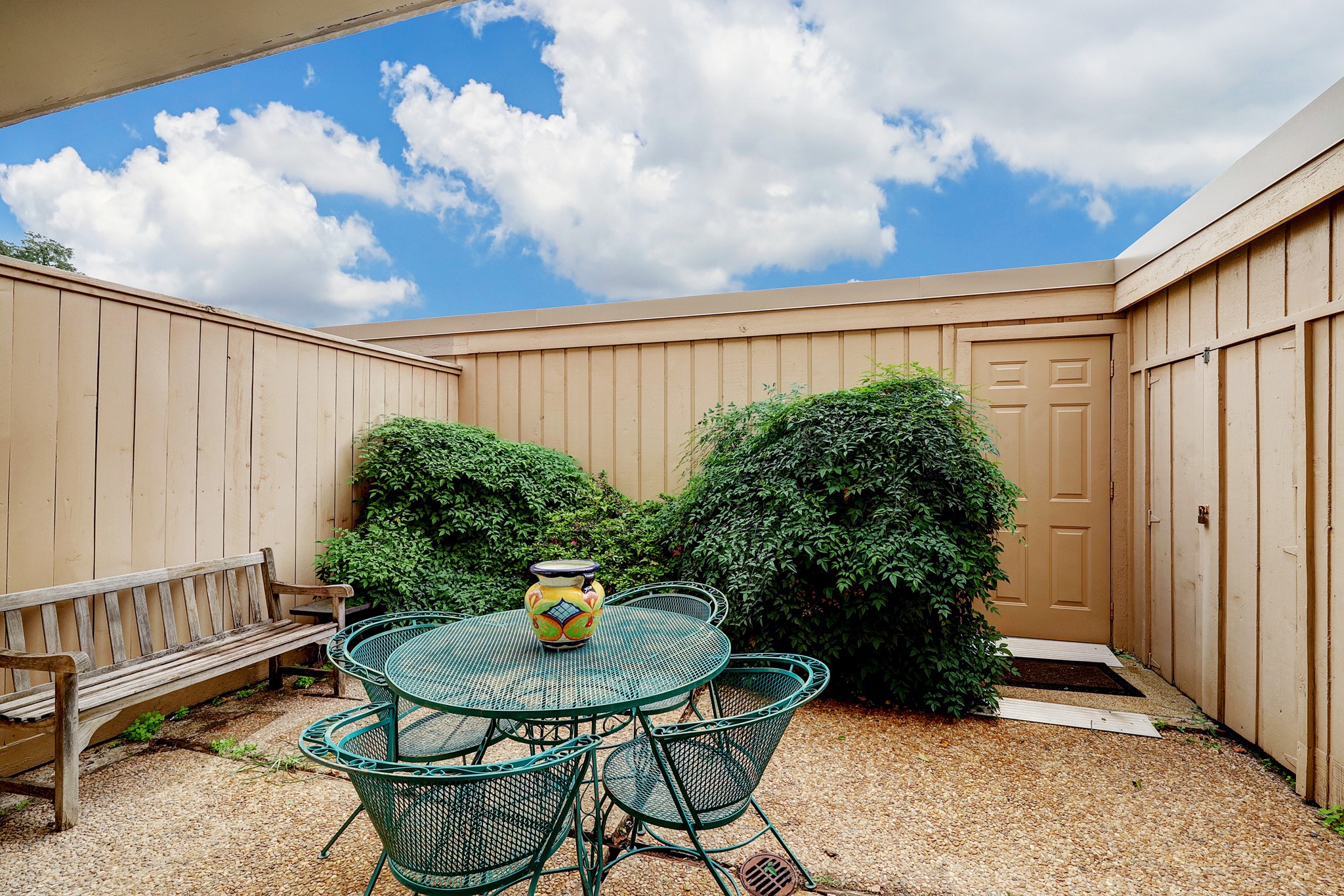The backyard patio is a great place to wind down in the evening or have a cup of coffee in the morning! Through the door is the detached 2 car garage.