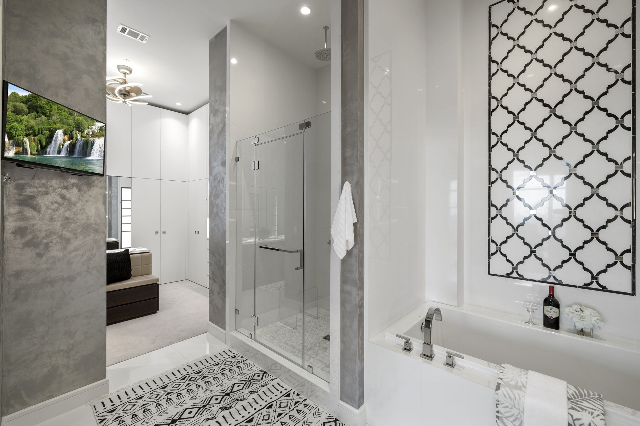 Step into a custom his/her split primary bath, thoughtfully designed to exceed the highest expectations. This luxurious oasis showcases a stunning oversized primary closet, catering to your every desire.