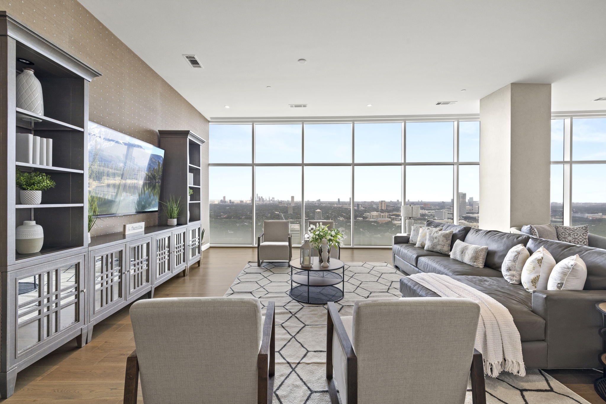Step into this living room and immerse yourself in the captivating city views.