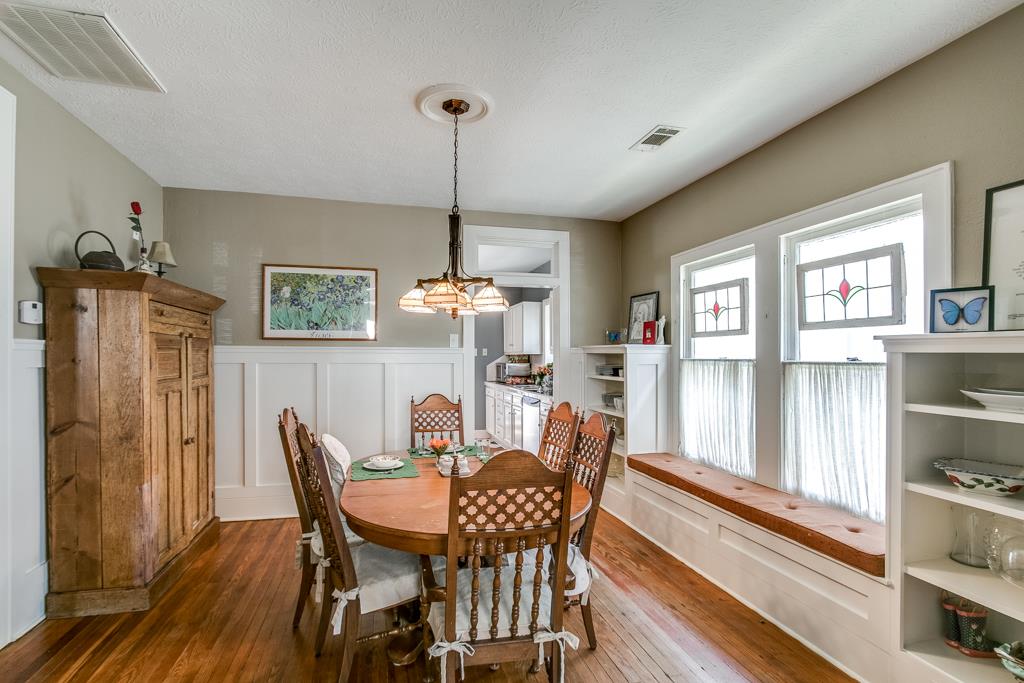 Formal dining room with built-in and large window seat add to the charm of this home.
