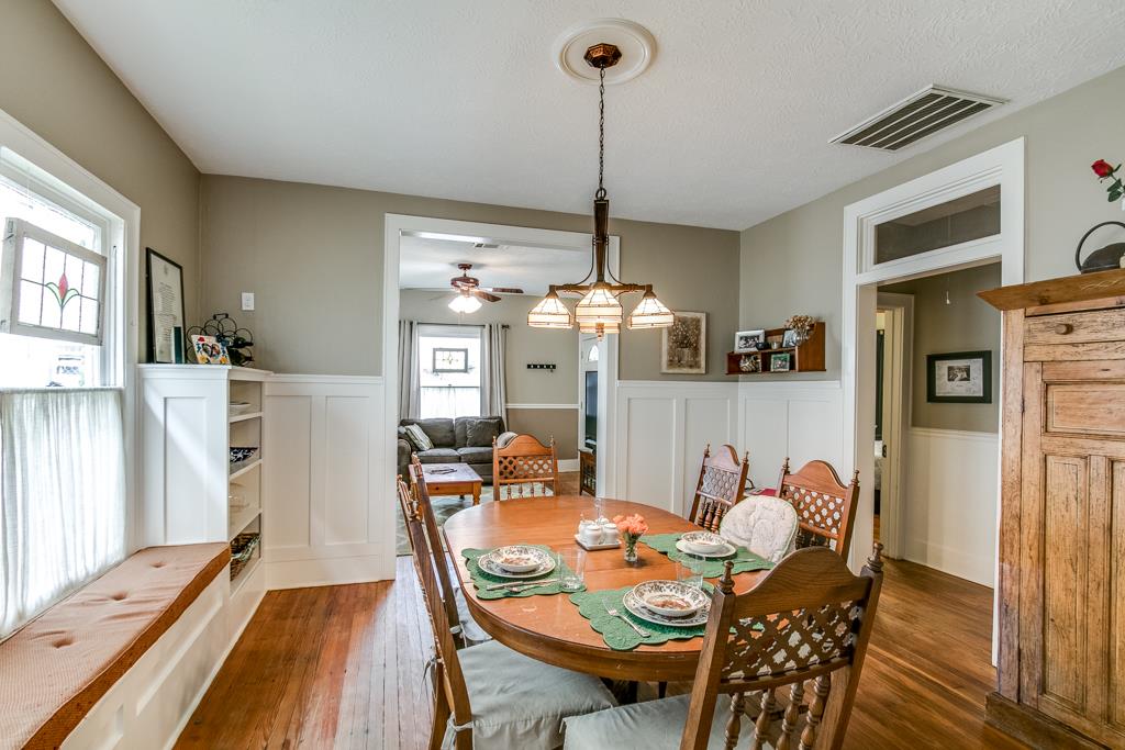 Warm hardwood floors and updated lighting throughout.