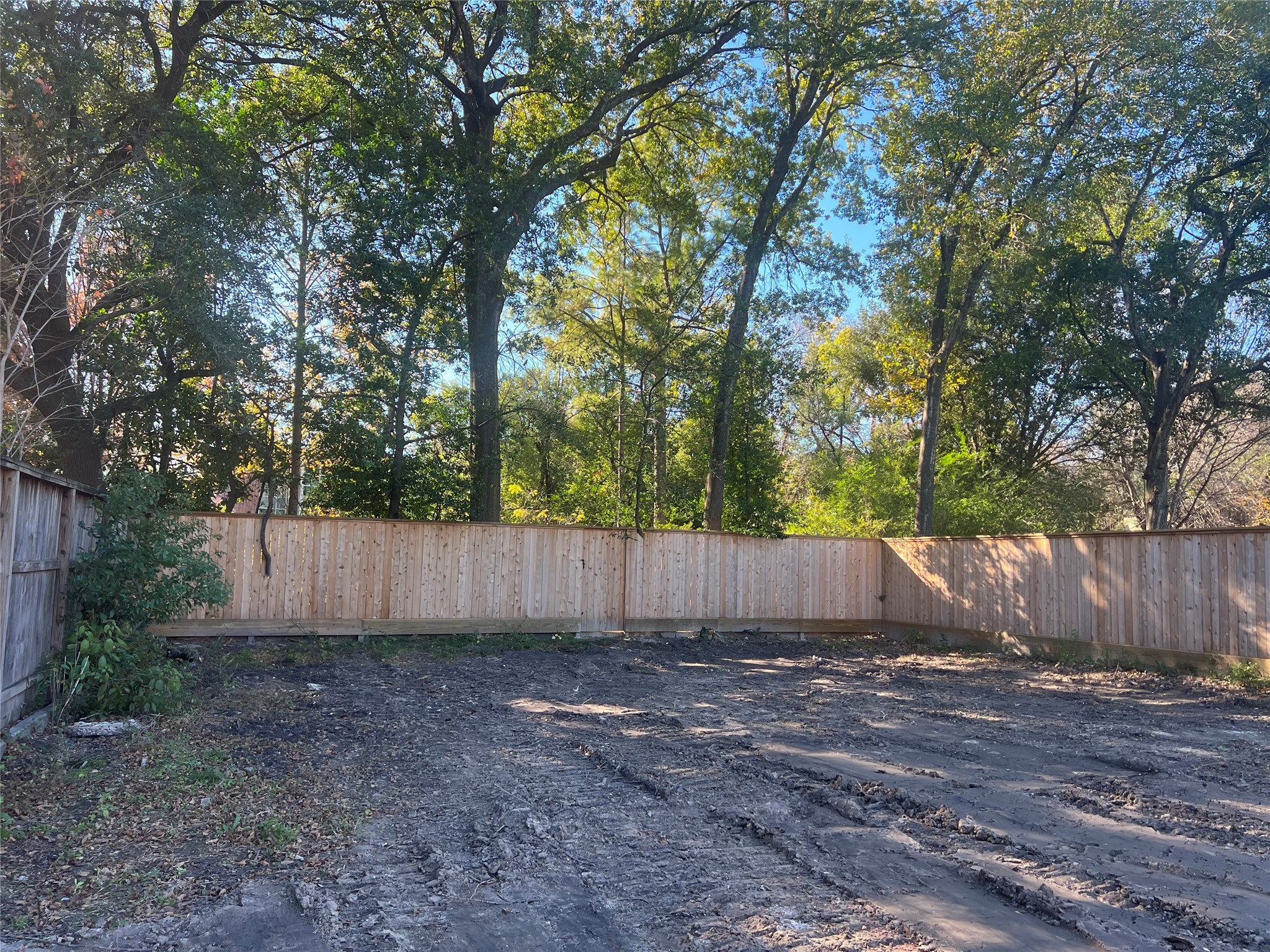 This is a picture of the lot standing where the back of the house will end, showing the scope of the wonderful backyard. There is no neighbor house behind the property.