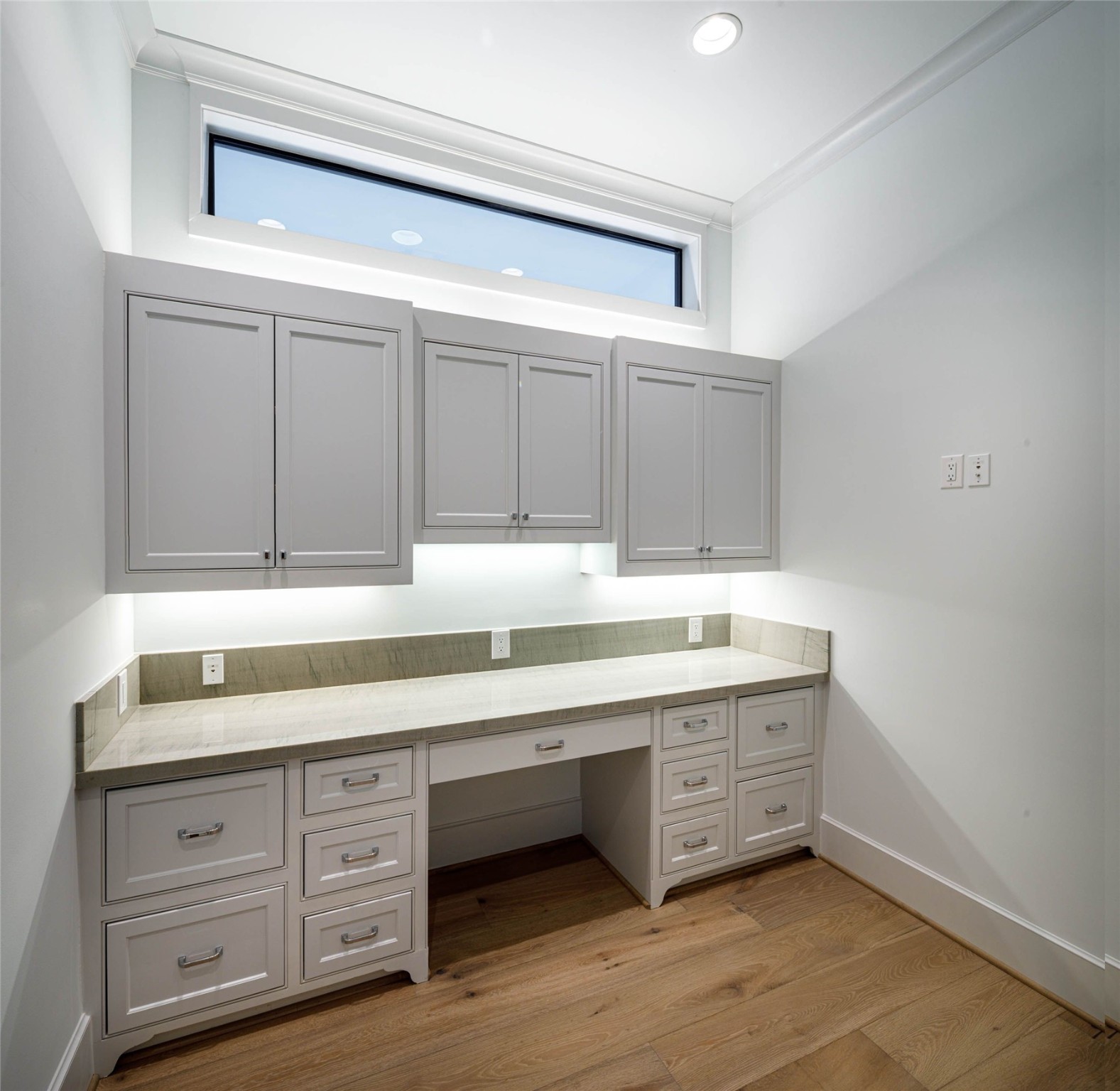 Second office or work space with custom built-ins and easy access to the kitchen