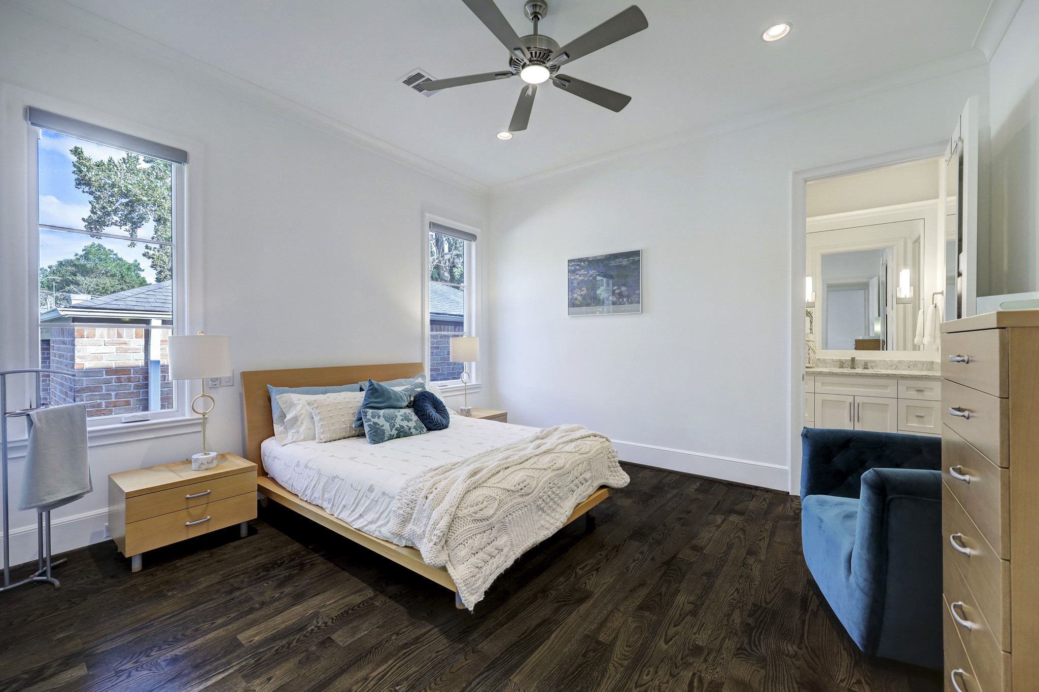 Cozy guest suite with Minka Aire ceiling fan plus light, Graber remote-controlled
shades, en-suite bath, and vast custom-built walk-in closet.