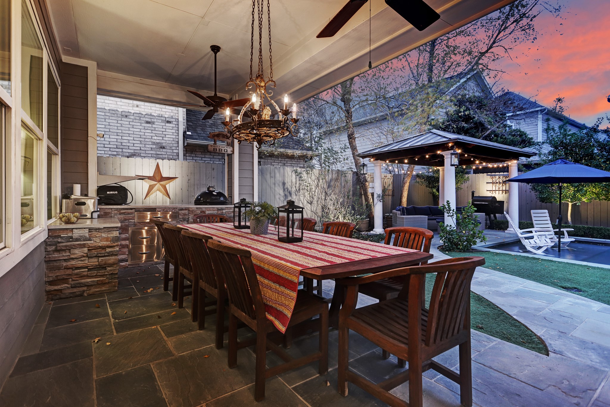 View of the outdoor kitchen and pergola.
