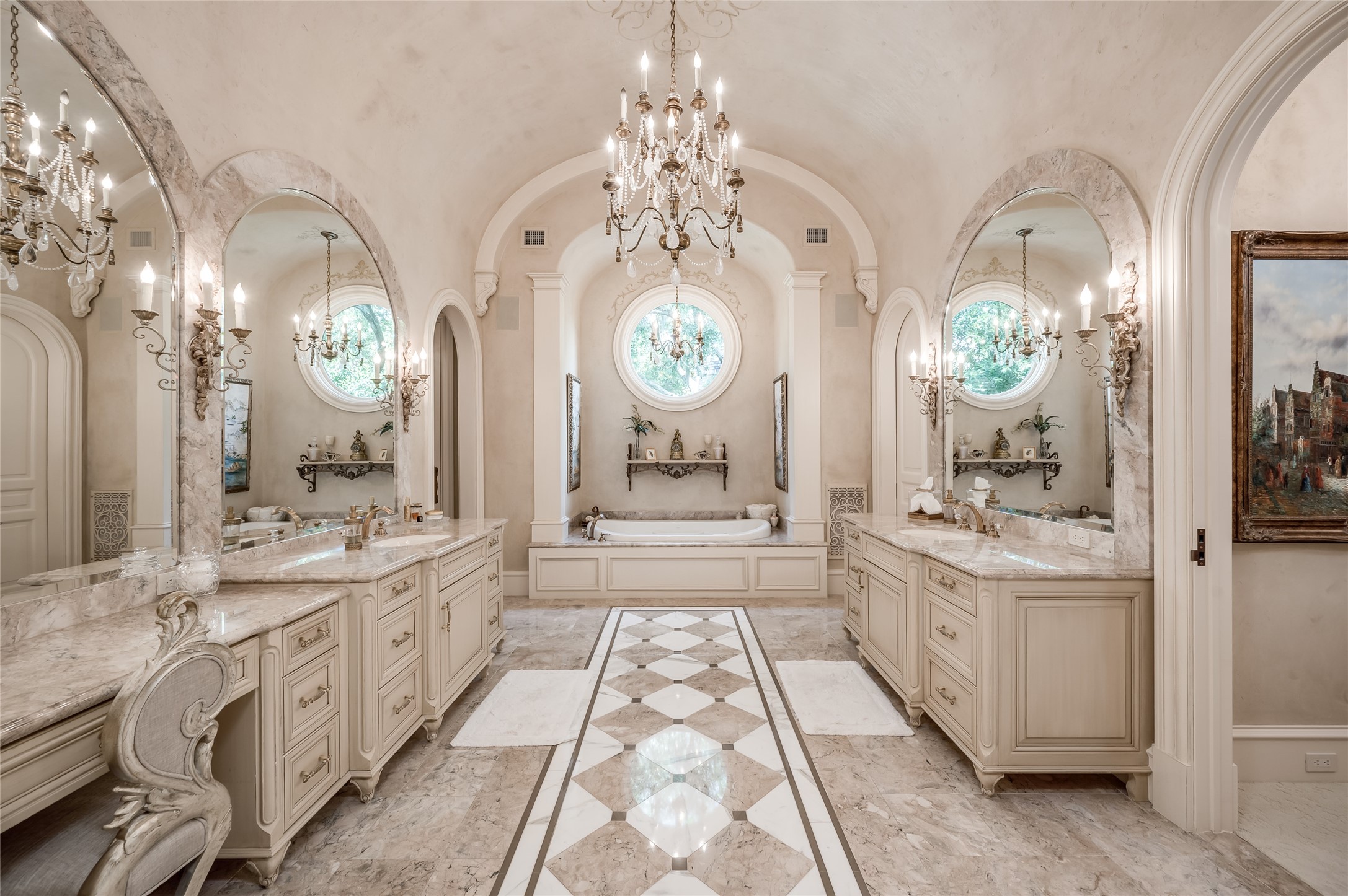 [Primary Bath]
The sumptuous primary bath has a barrel ceiling, marble double sink decks, two water closets, two dressing areas, a vanity, Bain Ultra air tub, and a shower room with kidney-shaped bench.