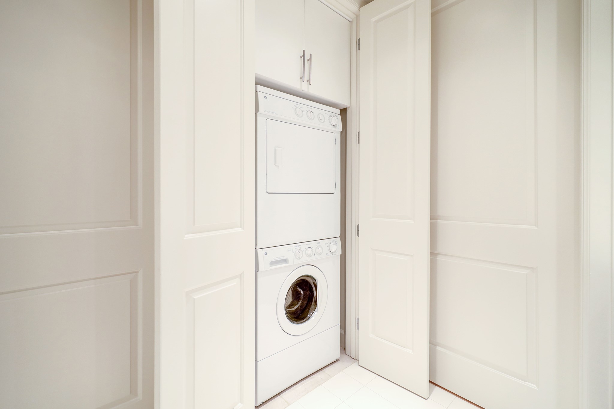 Washer and Dryer Will Stay and Are Tucked In Behind a Door in the Bathroom for Total Privacy.