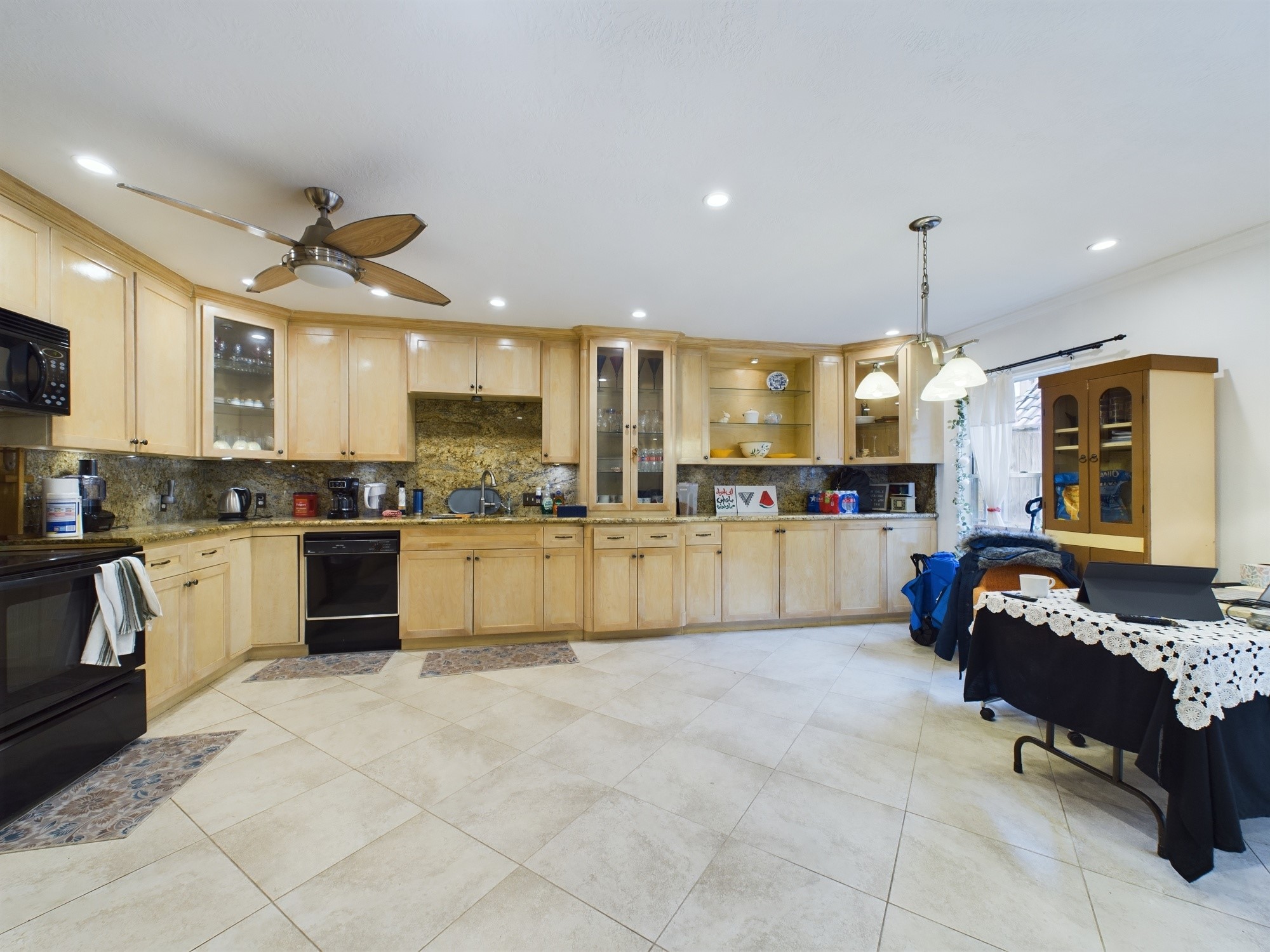 Spectacular Eat-in Kitchen!  Tons of Cabinets, Glass Front Doors & Matching Granite Countertops and Granite Backsplash