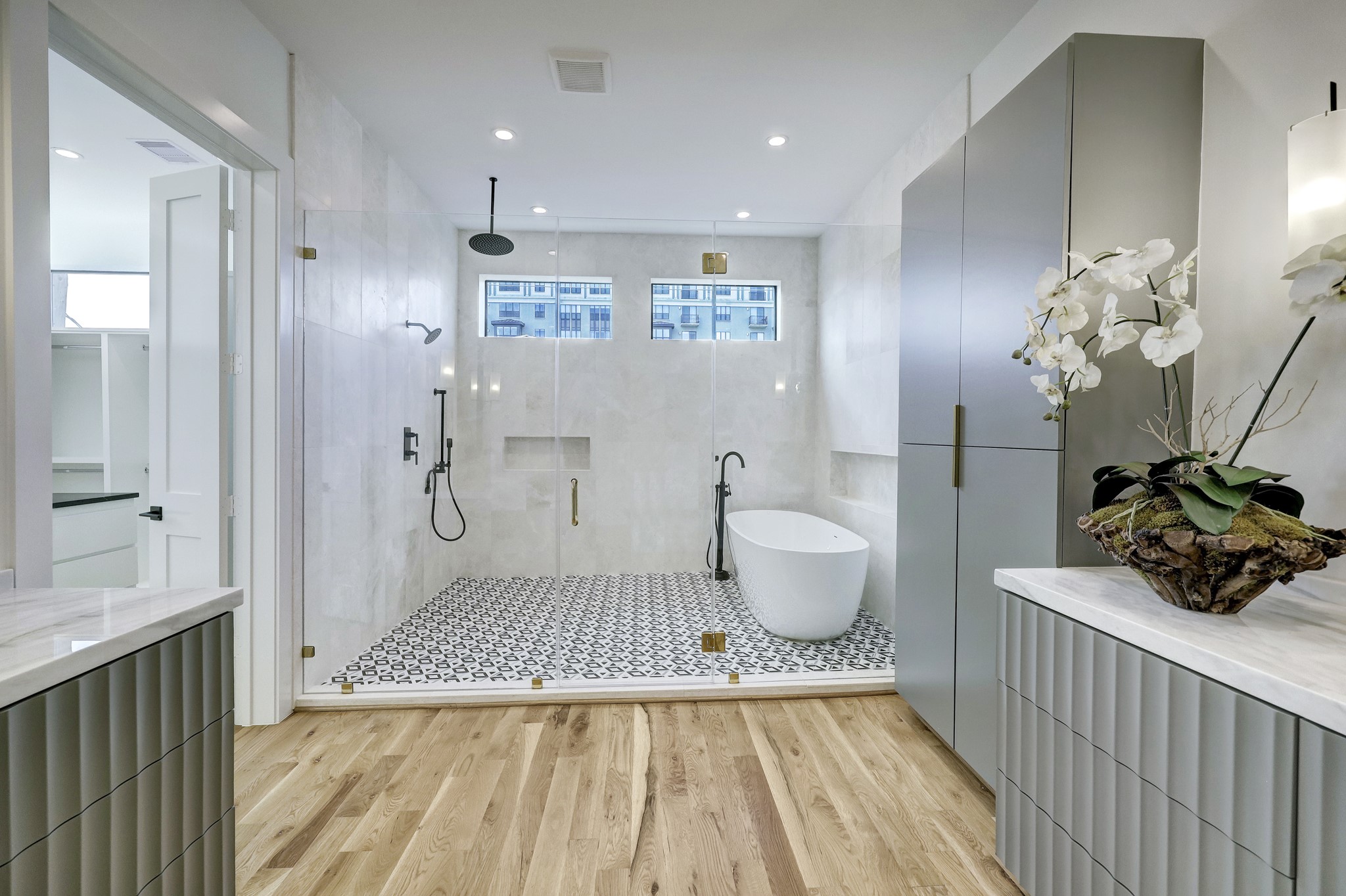  marble primary bath offering glass enclosed wet room plus dual counters