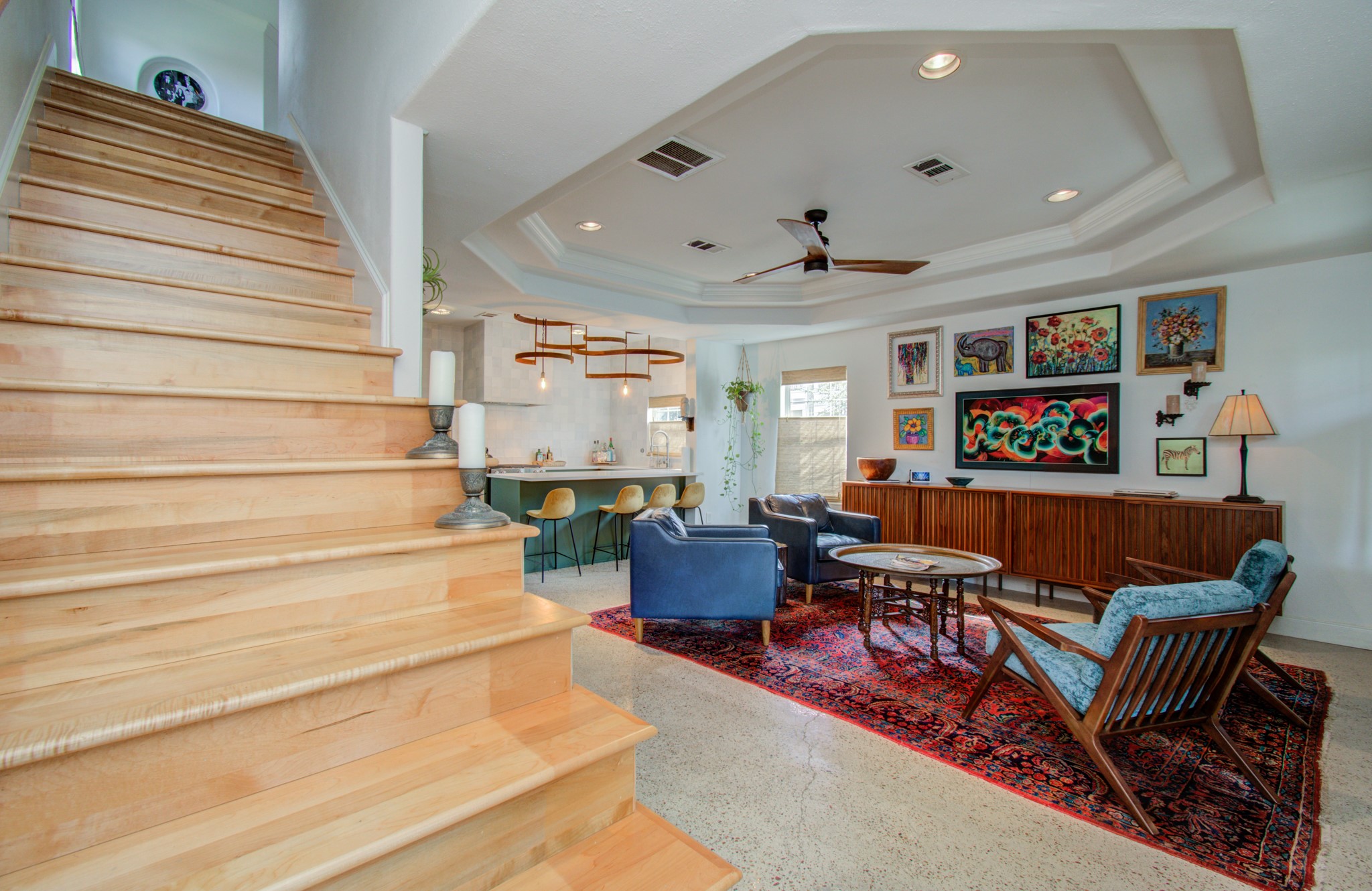 As you ascend the stairs, you are greeted by solid maple floors and stair treads, extending the warmth and elegance to the upper level of the home.