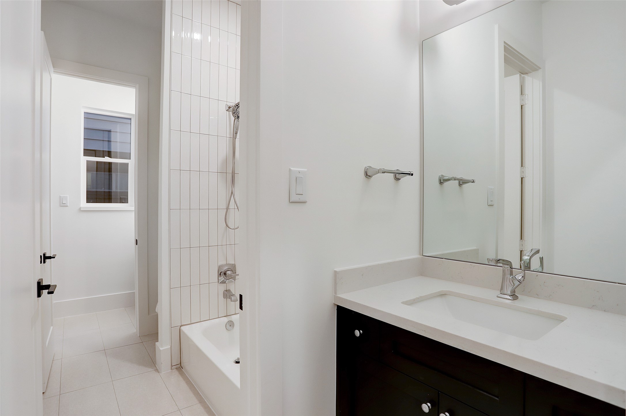 Bedrooms 2 and 3 share oversize Jack-and-Jill bathroom with each room having their own private vanity area.