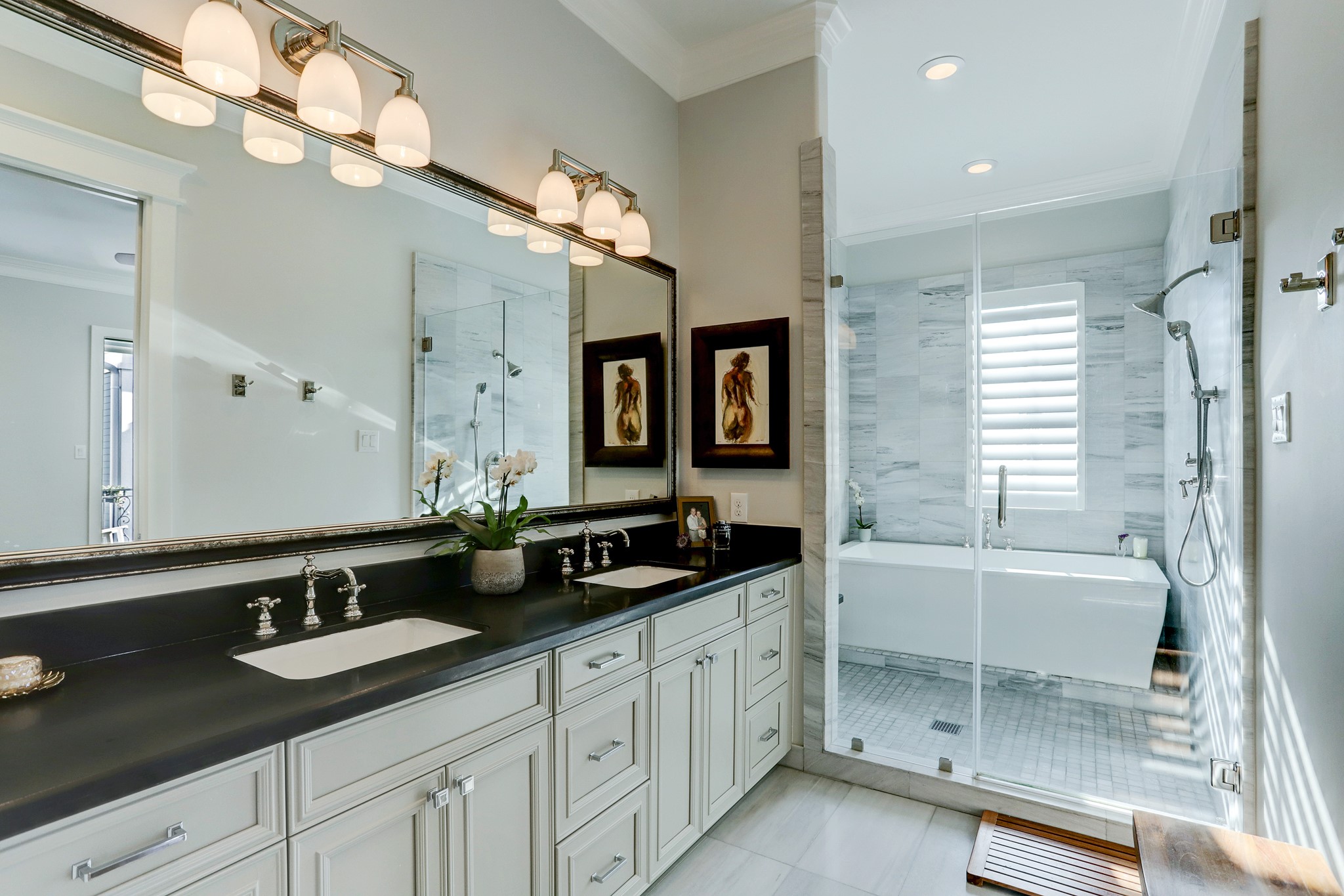 As you enter the spa-like primary bath, you'll notice all the designer finishing touches and double sinks. This retreat also boasts two walk in closets!