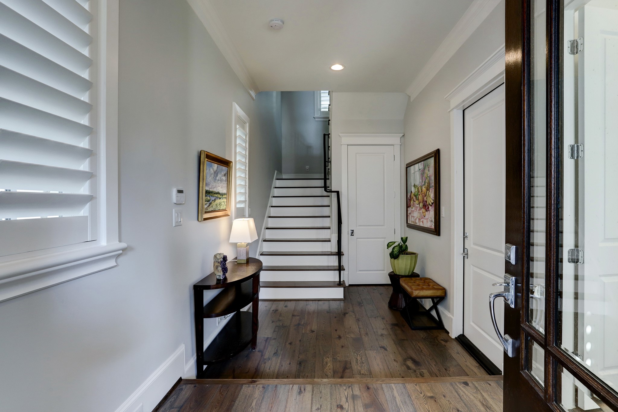 Welcoming entry with an oversized under the staircase closet and access to the garage as well as the first floor bedroom.