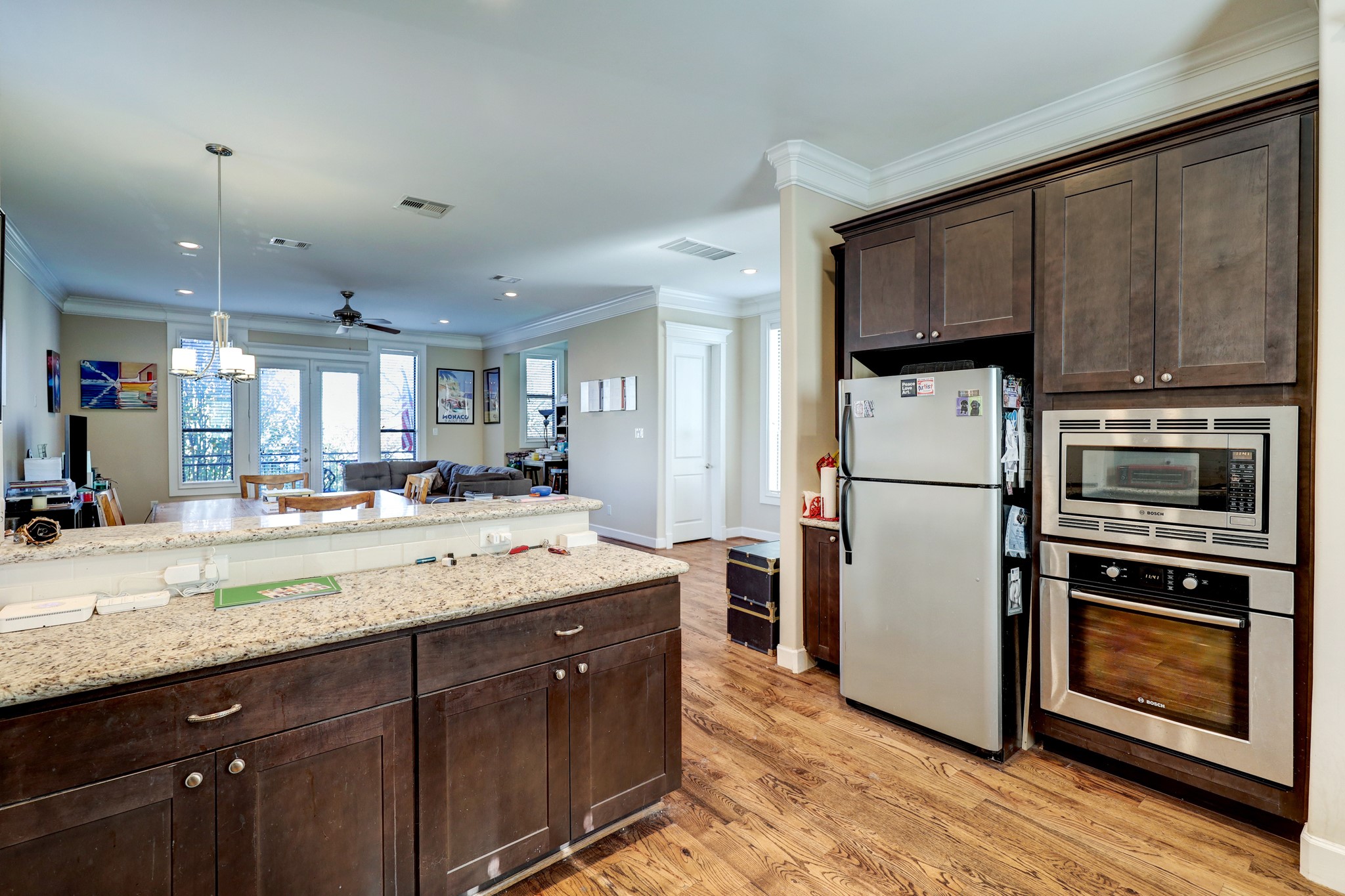 The kitchen opens up to the dining room which is perfect for entertaining. Noticed the built-in over and microwave.