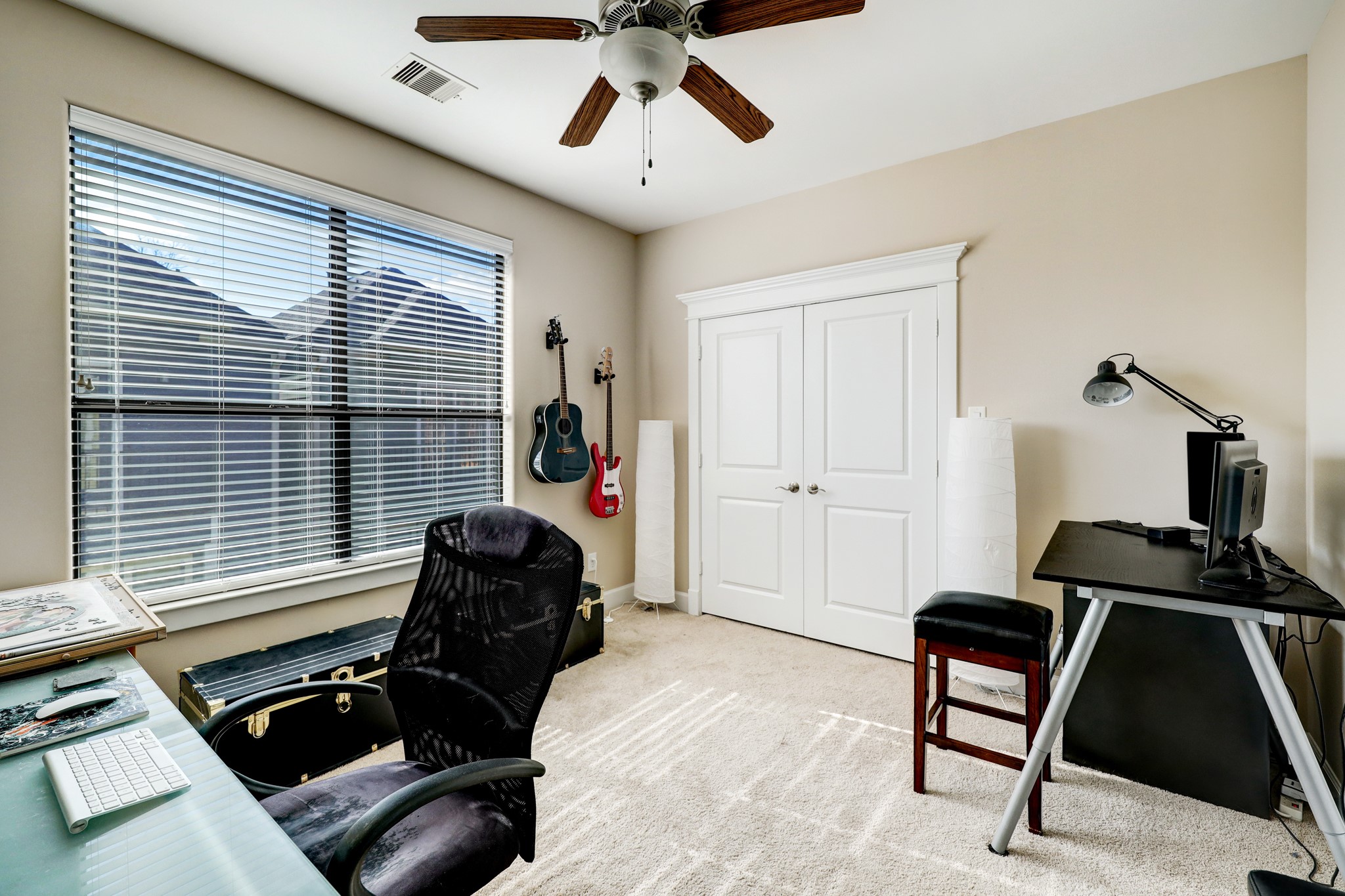 The secondary bedroom on the third floor is great location for an at home office or workout room!