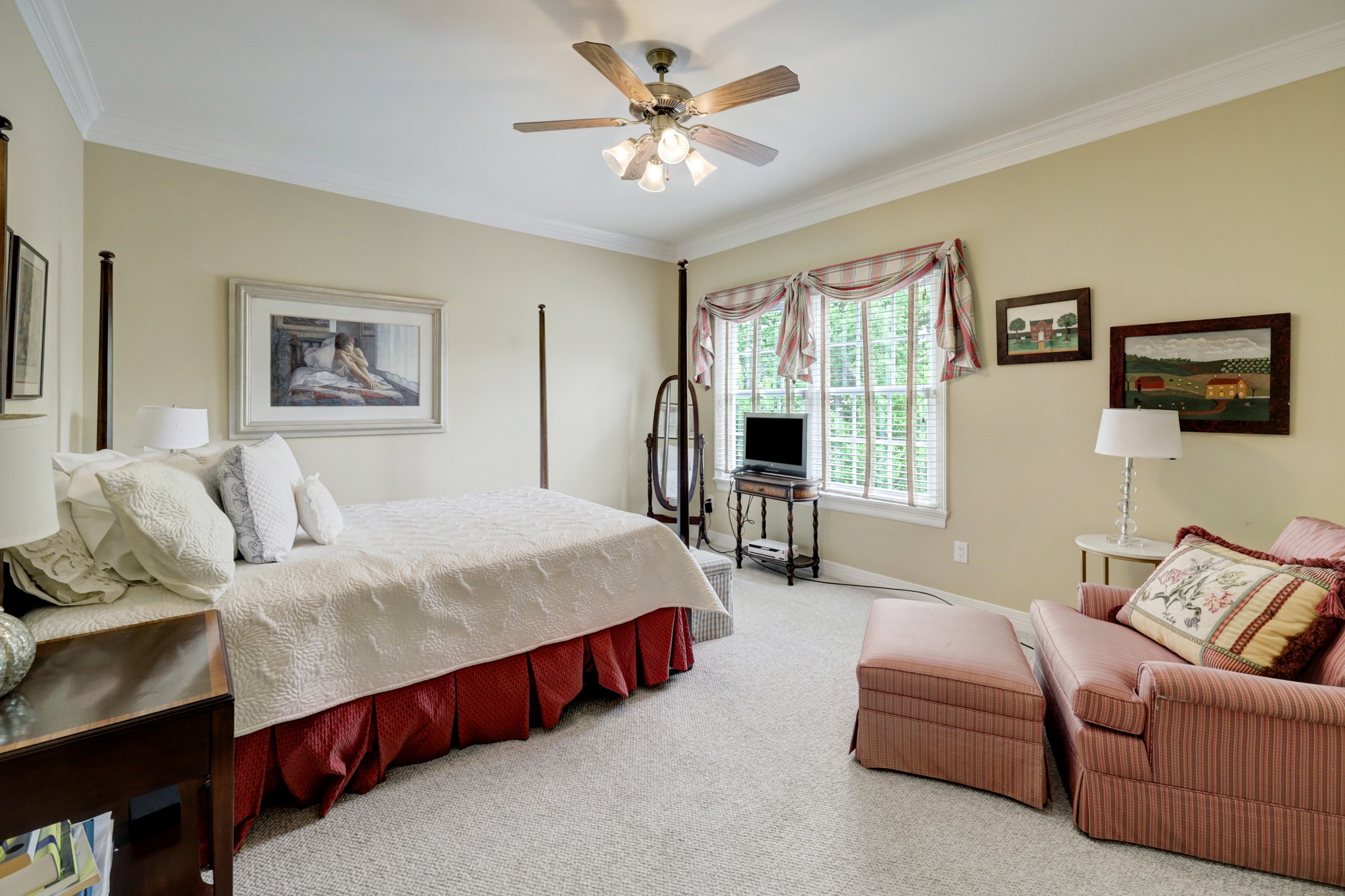 Guest bedroom located on the second floor with en suite bathroom, carpet and walk-in closet.
