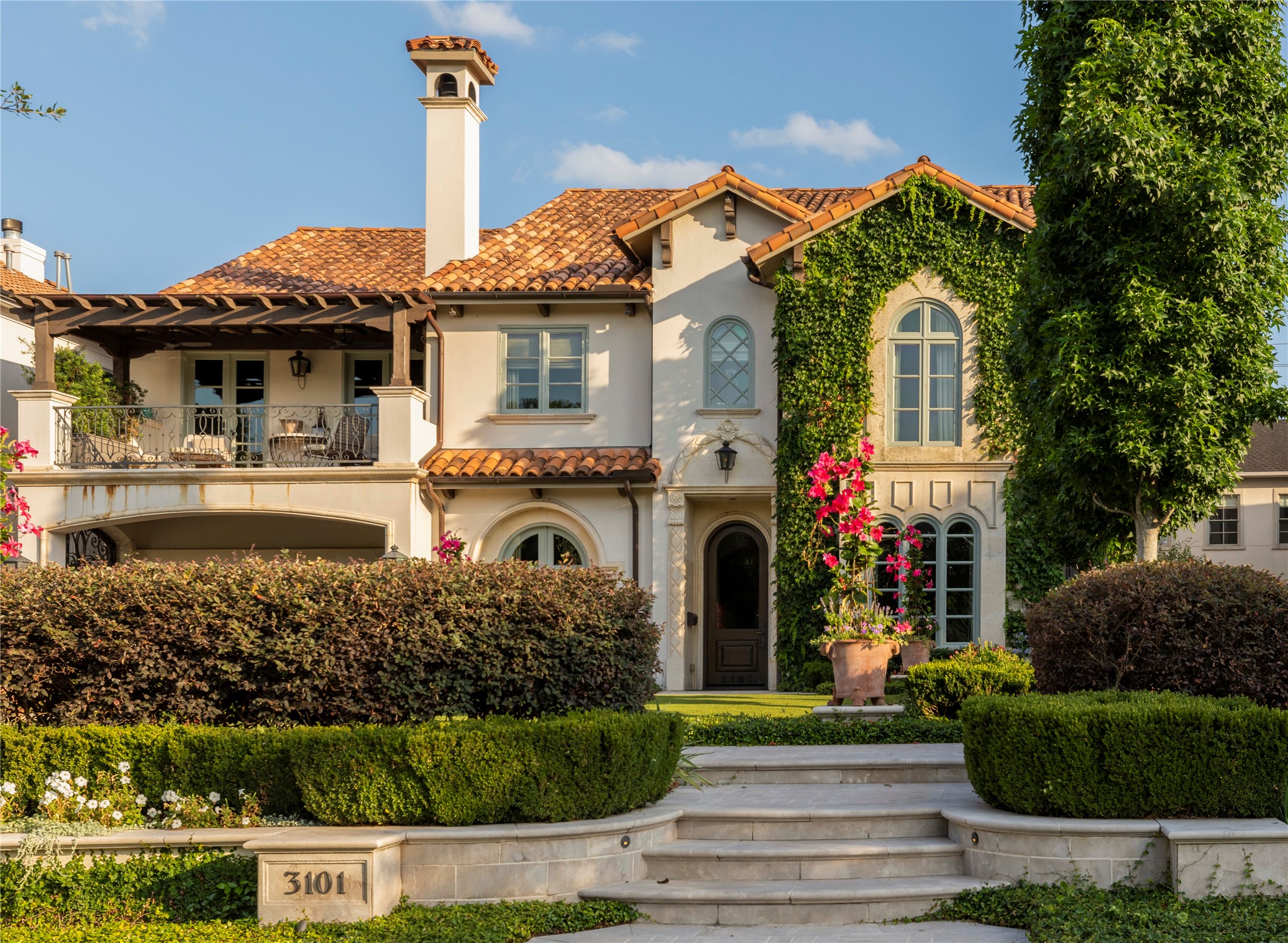 Welcome to 3101 Avalon Place - an enchanting home in the heart of Avalon Place. The exterior is exquisitely adorned with hand-carved limestone accents, a clay tile roof,  copper gutters and downspouts, and immaculately manicured grounds.