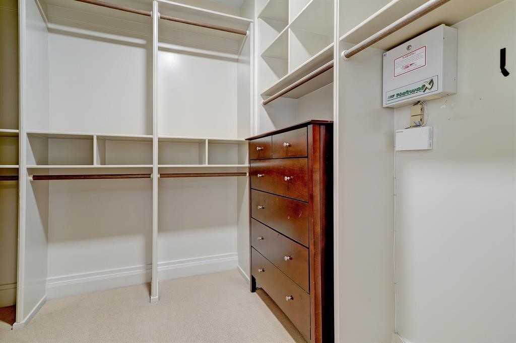 Large walk-in closet. One of two primary closets.