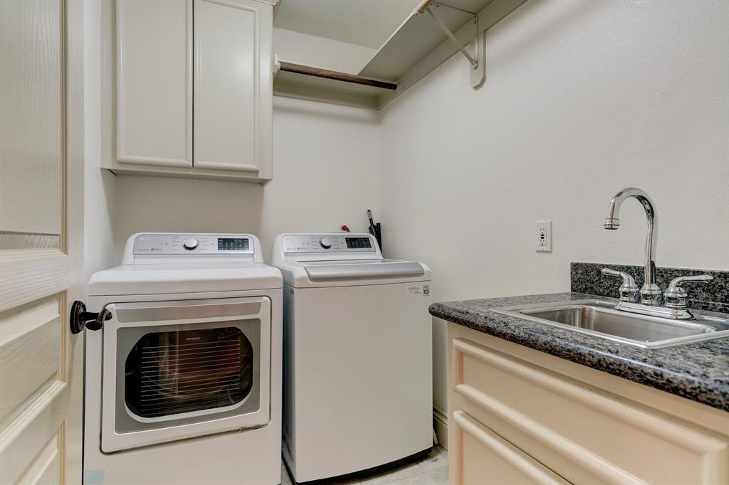 Laundry room located on the third floor with sink and plenty of hanging room. Washer and Dryer are included.