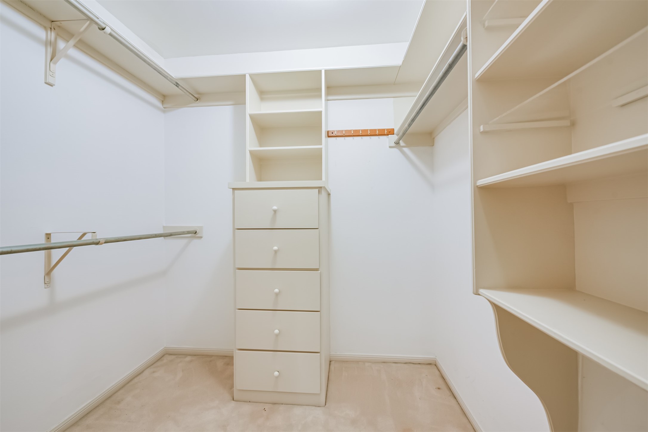 One of two identically sized walk-in closets within the Primary bath space.