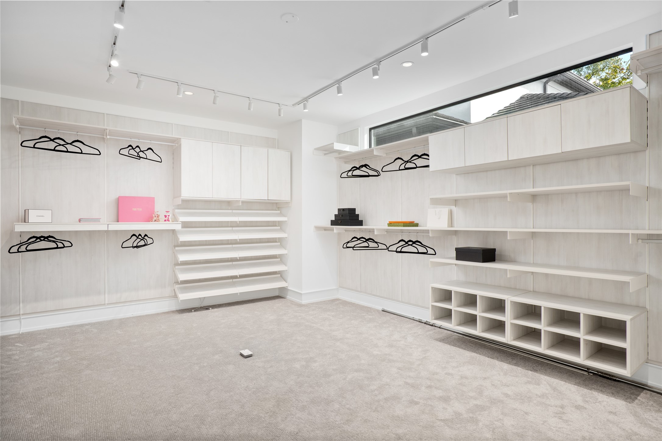 The expansive primary closet. Photos depict when home was previously staged