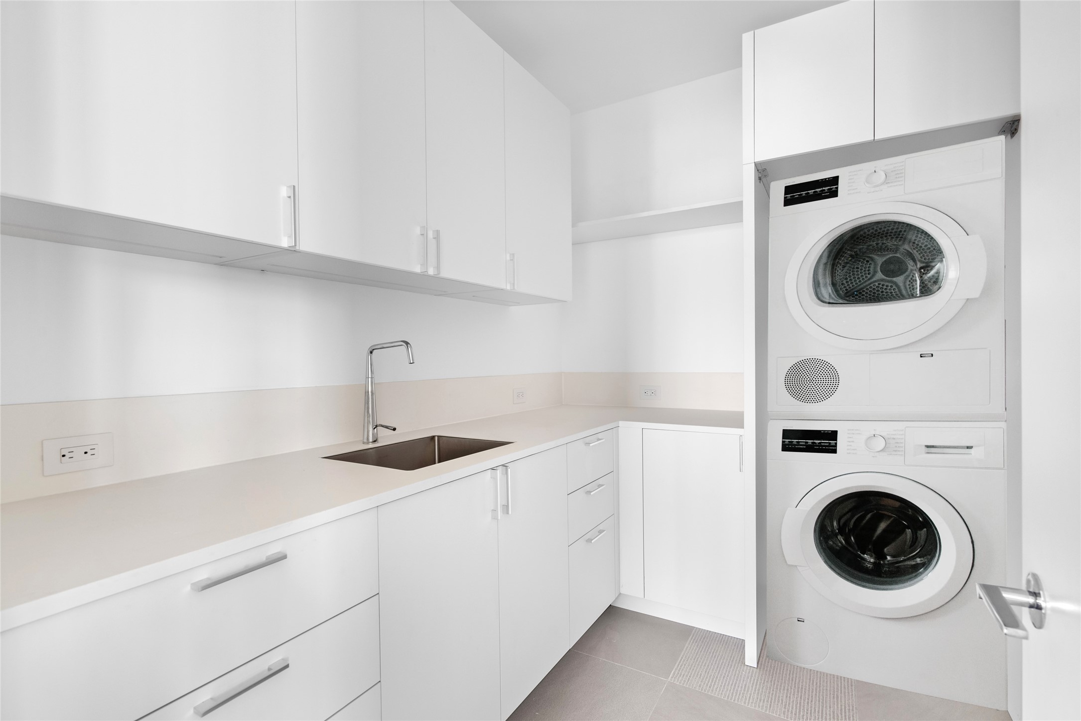 Spacious laundry room situated on the 2nd level with plenty of storage for household essentials. The washer/dryer have been virtually staged.