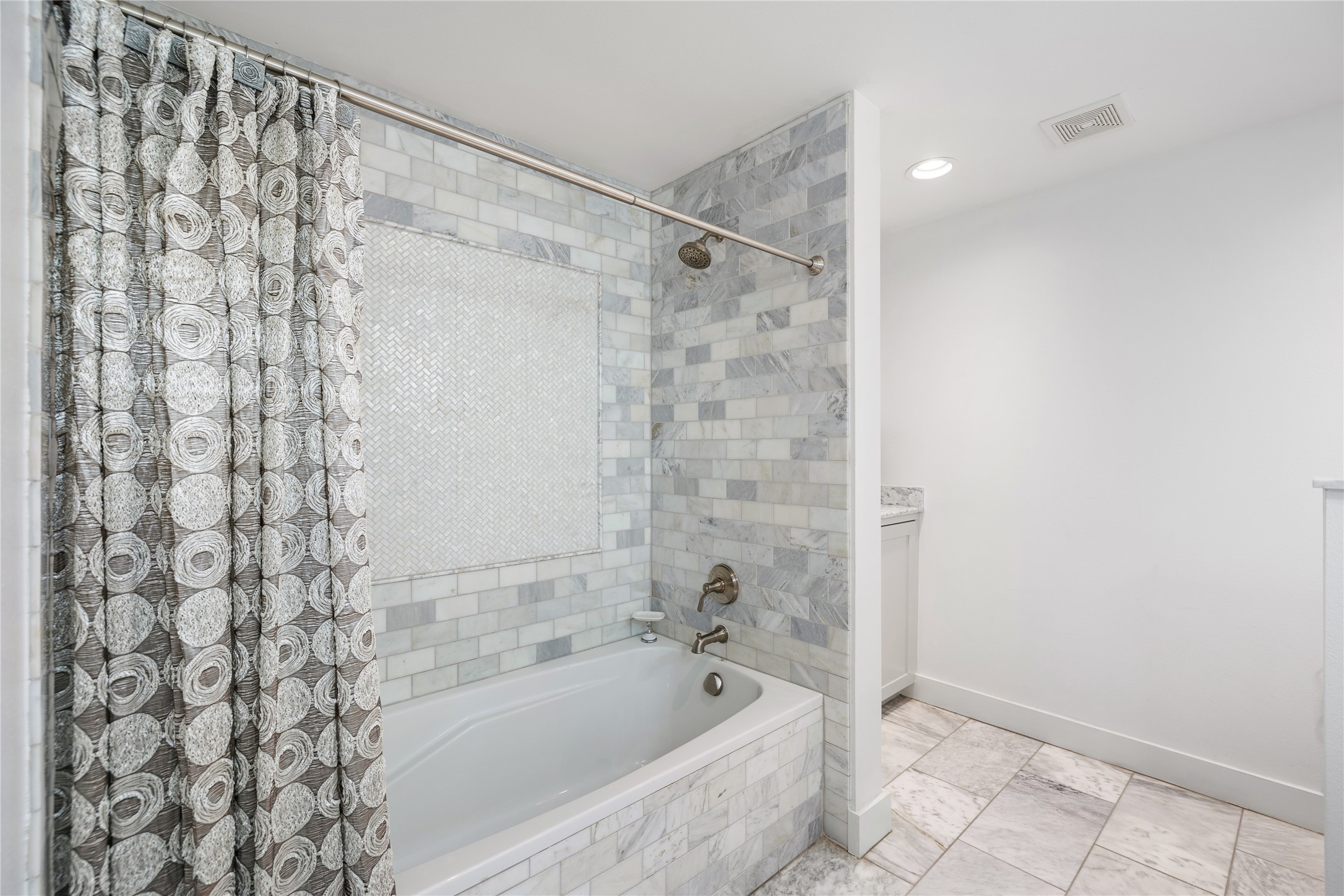 Adorned with marble and mother-of-pearl tilework, you will feel like you're at a spa in this bathroom.