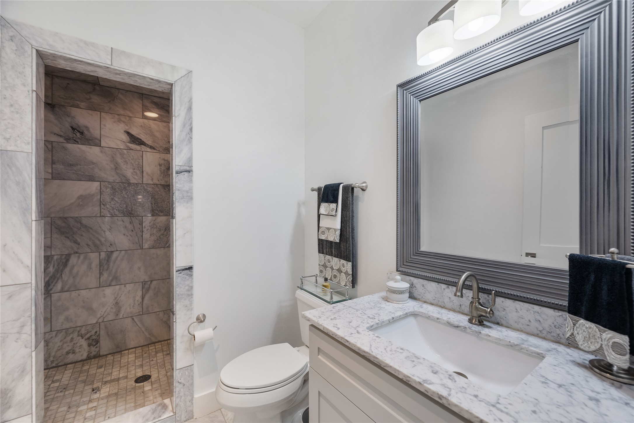You will love this luxury bathroom, located next to the second bedroom. Fitted with luxury finishes such as the large walk-in shower and marble tile work throughout.