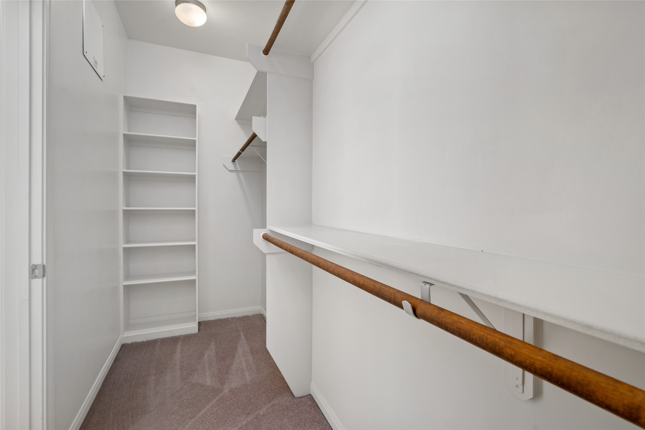 Tired of sharing a closet? Let's change that! This is one of the two walk-in closets connected to the primary bath.