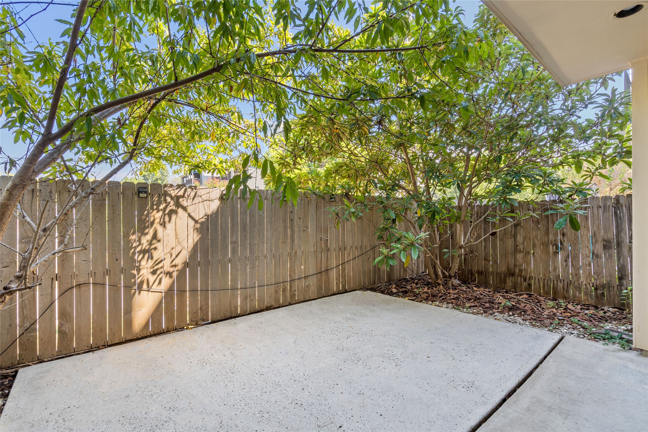 The back yard patio is the perfect space for the cooler summer evenings or weekend barbecues. Per seller, there are peach and loquat trees to enjoy!