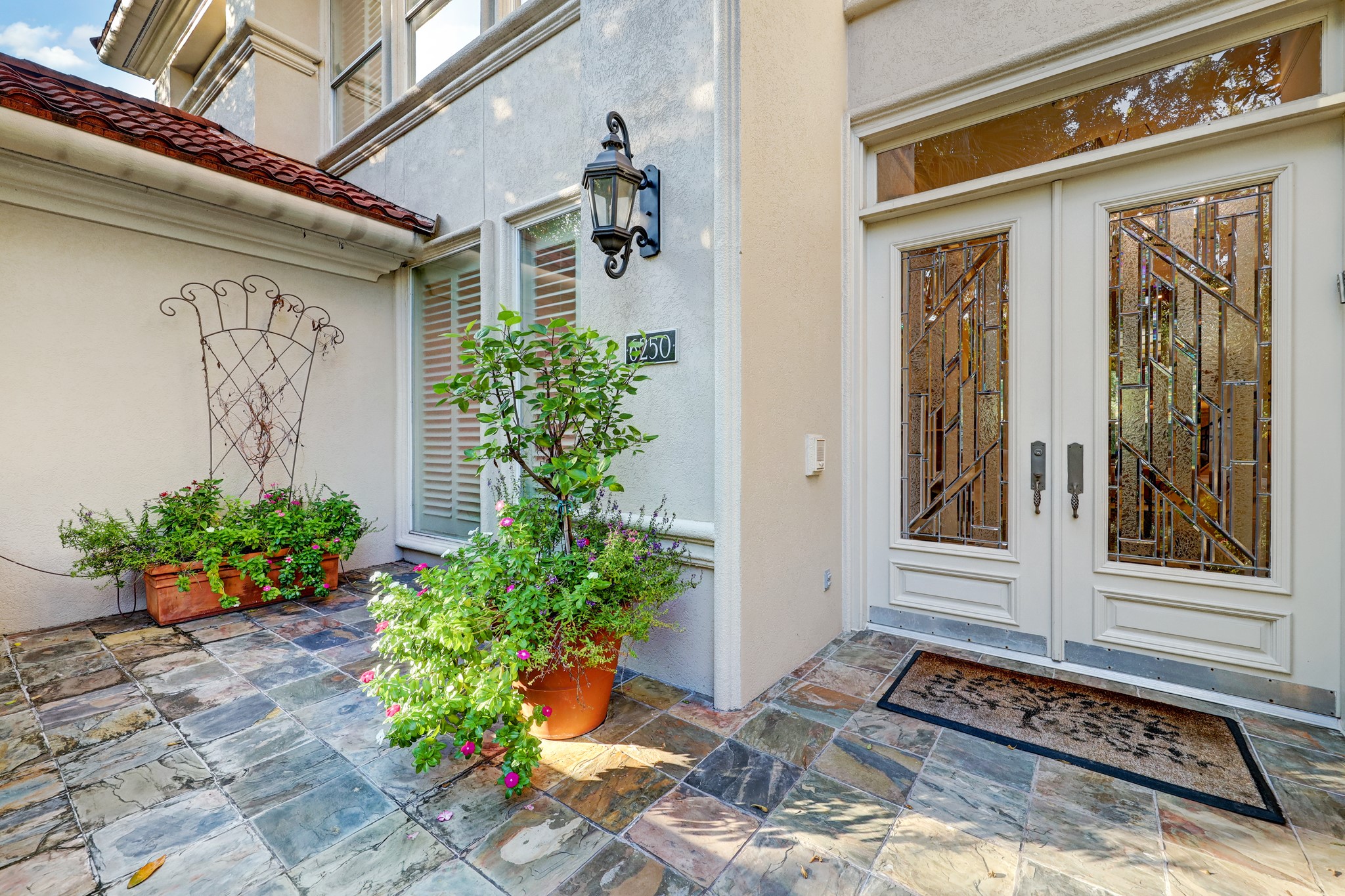 Inviting front patio with ample space for outdoor relaxation and entertainment, perfect for enjoying the neighborhood's charm and surrounding ambiance.