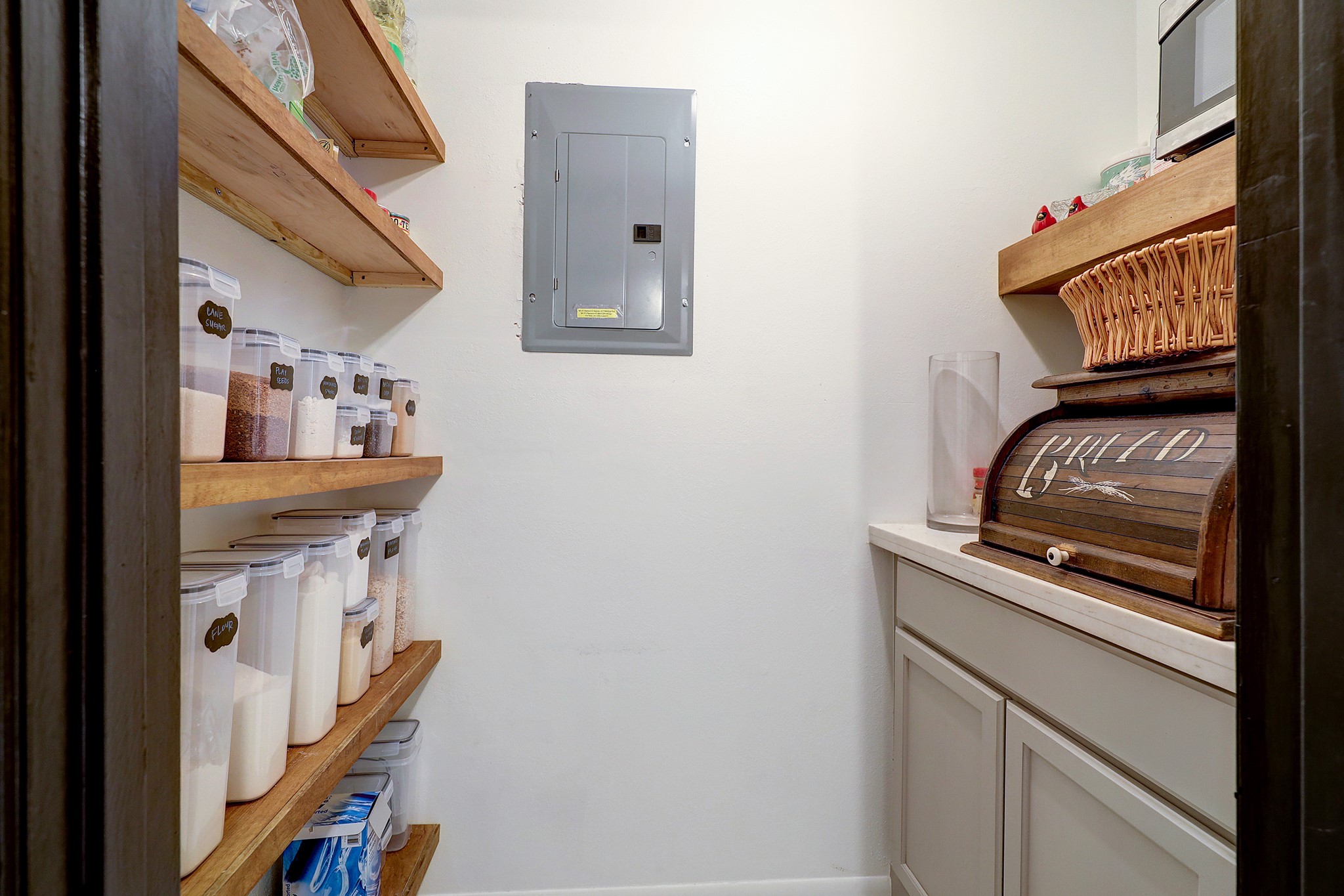 A cute walk in pantry and coffee bar area!