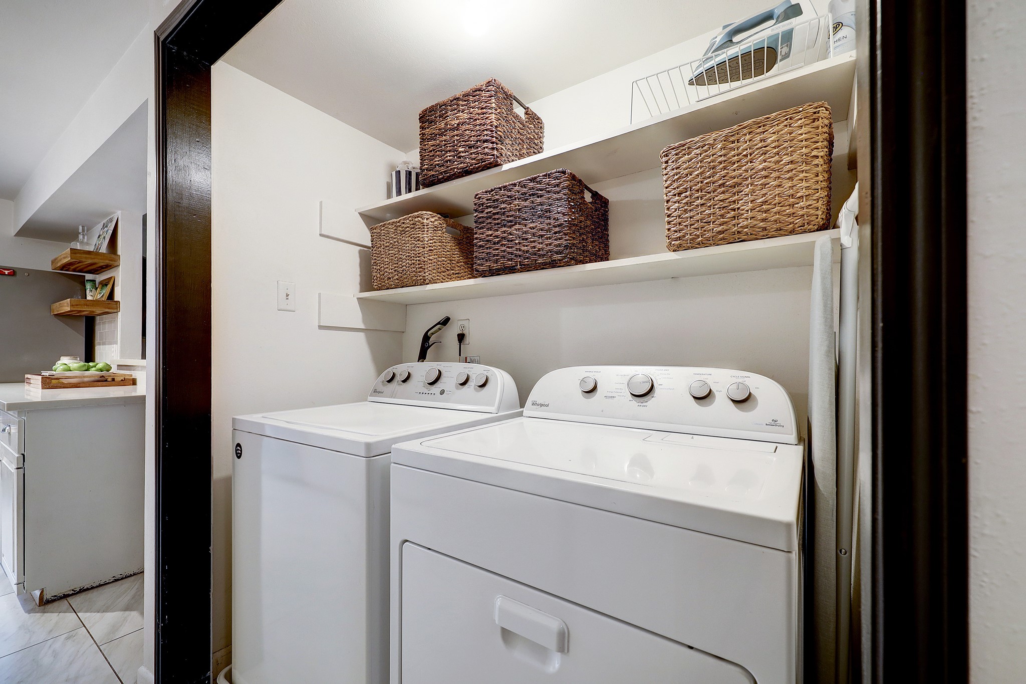 Laundry area is adjacent to the pantry, kitchen and downstairs powder bath.
