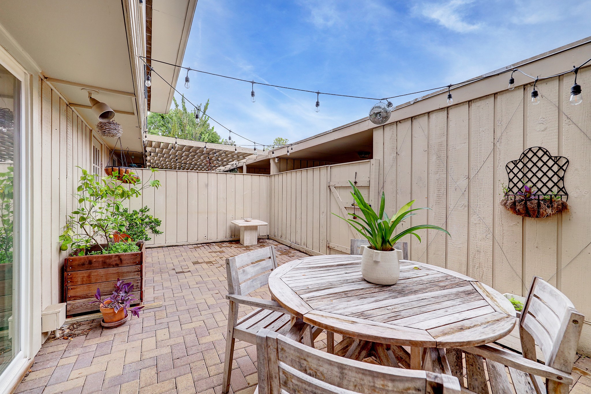 The large patio is perfect for entertaining or just relaxing. The patio leads to the garage and carport.