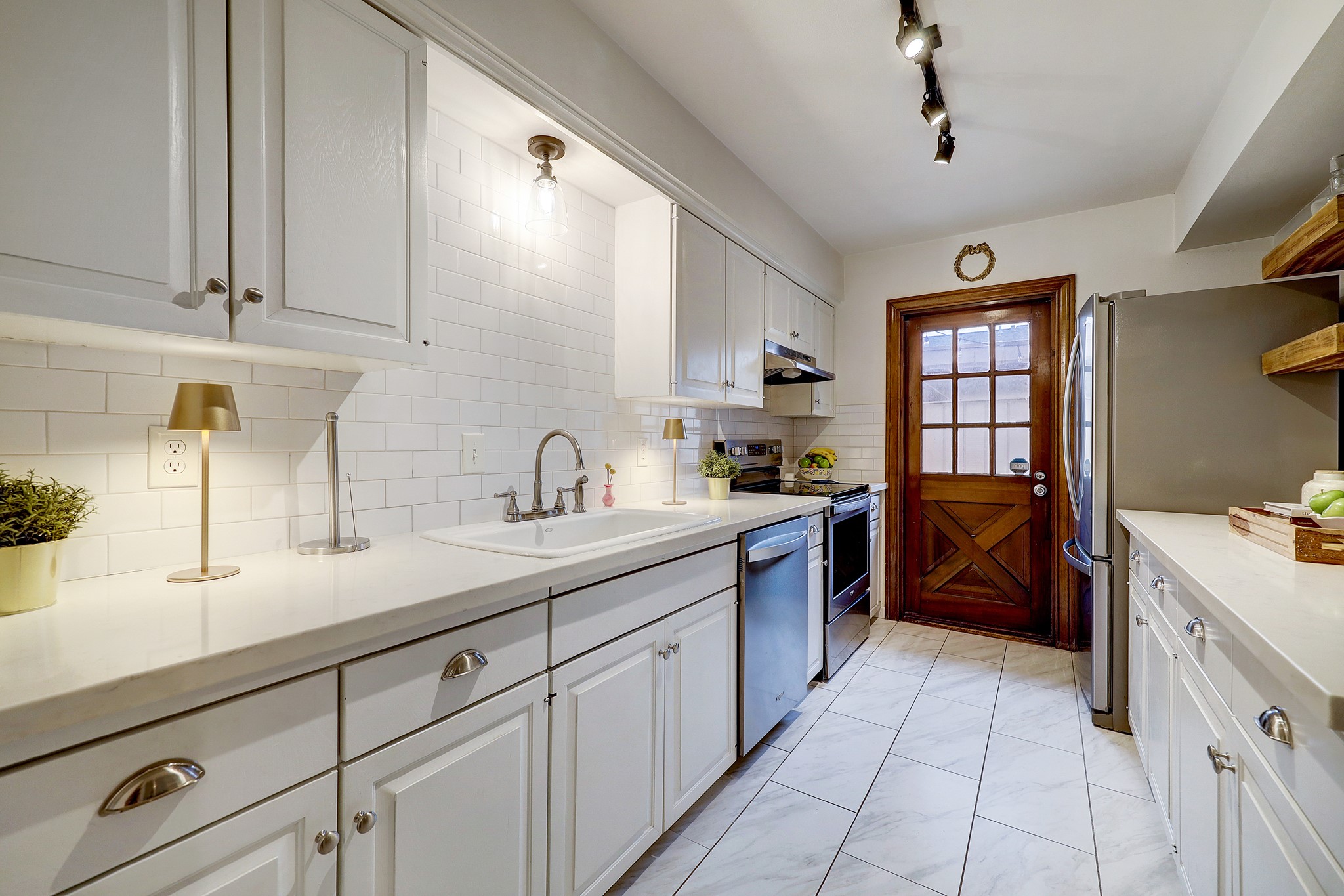 Porcelain tile floors, Koehler sink and updated light fixtures. *As per seller.