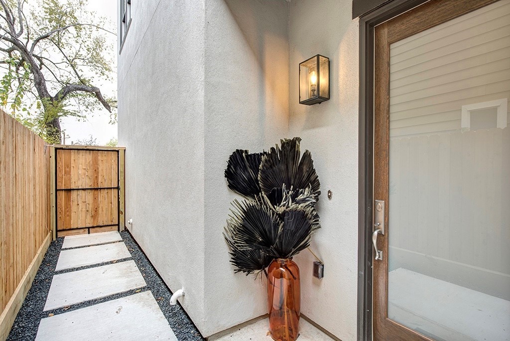 Private front entry with Restoration Hardware light. Home is wired for security cameras.