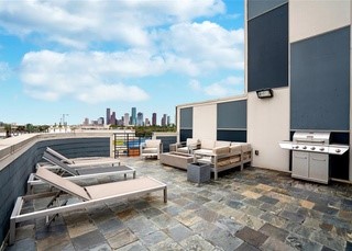 community roof top terrace with outdoor grill