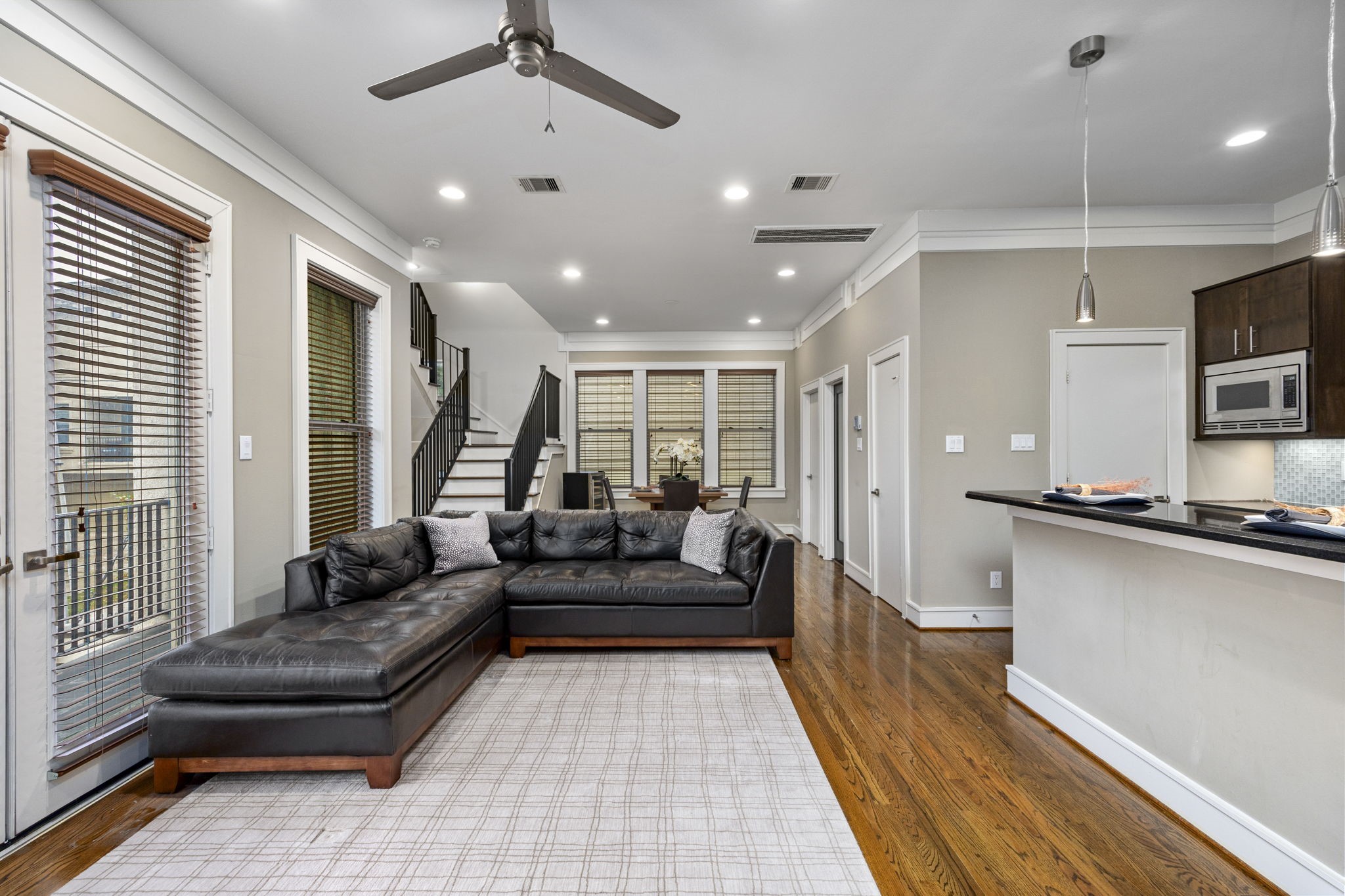 This living room is centrally situated overlooking the kitchen and dining area for your after-dinner conversations! 322 Patterson St., Houston, TX  77007