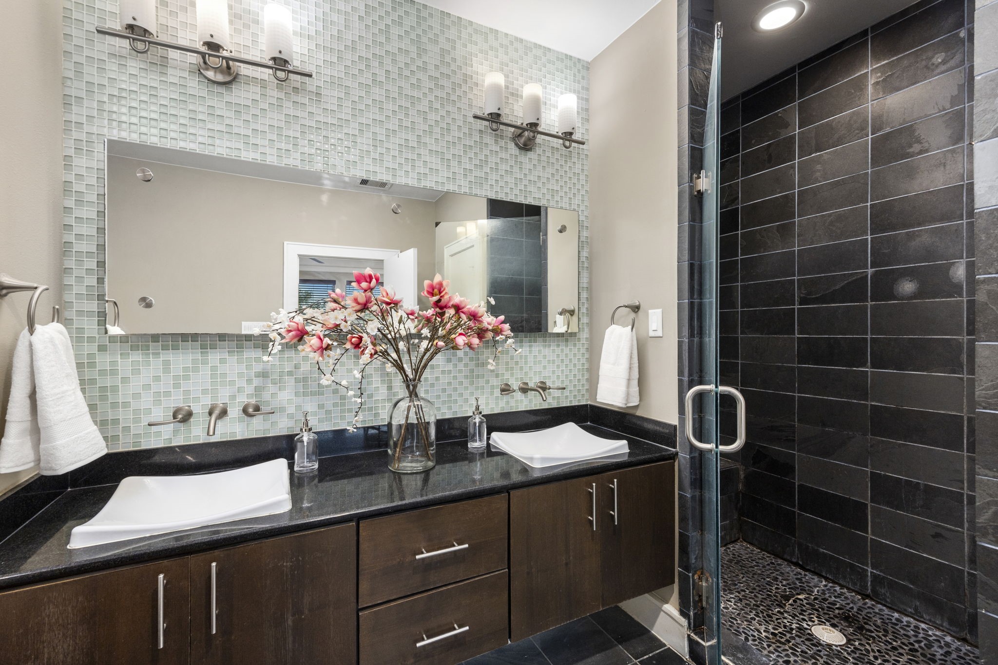 The Primary Ensuite provides Dual Sinks, Mosaic Glass Back Splash, a contemporary shower enclosure w/glass & modern trim! 322 Patterson St., Houston, TX  77007