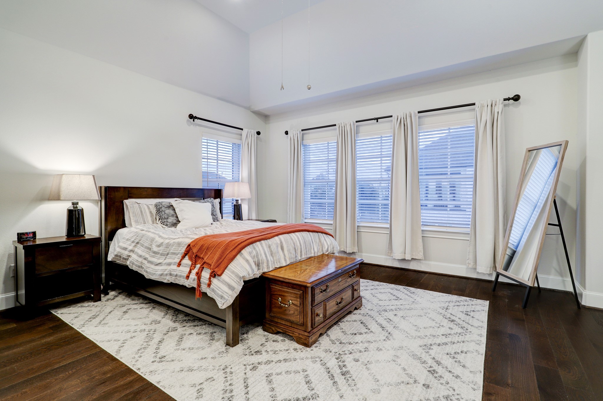 Abundant space can be found in the primary bedroom located on the 3rd floor with vaulted ceilings and engineered hardwood.