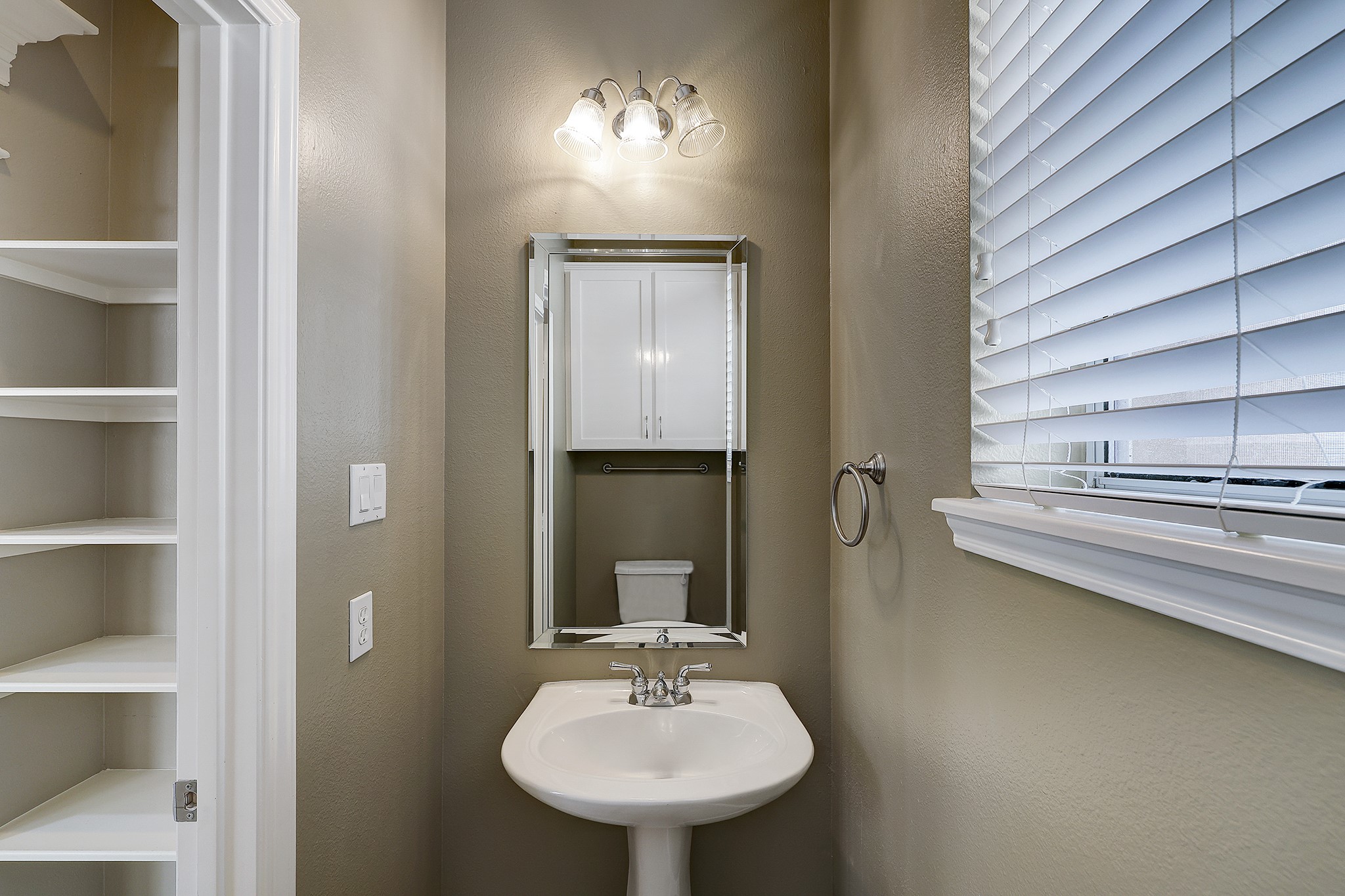 Conveniently located half bathroom on the main level, perfect for guest use