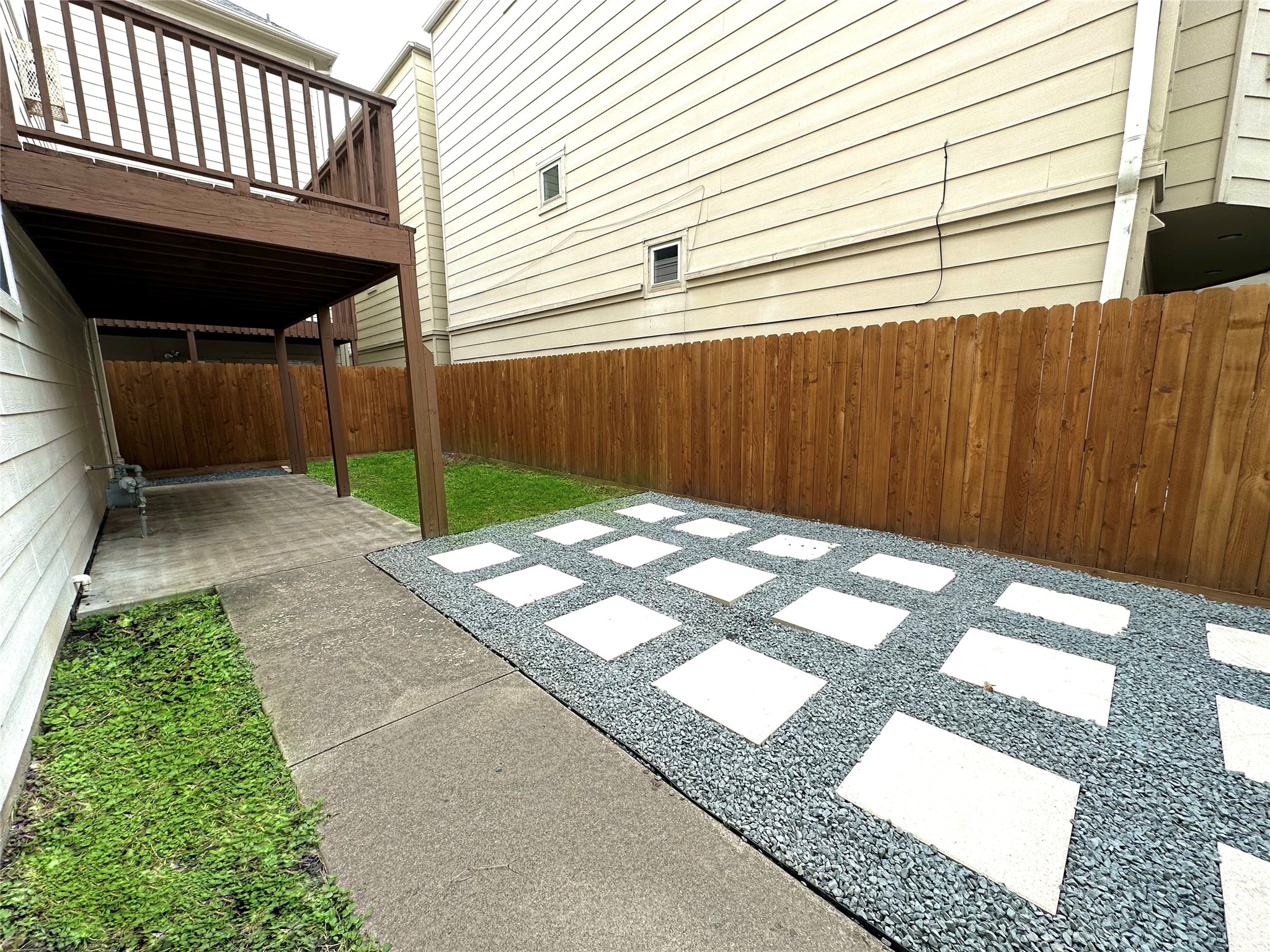 Expansive backyard with covered patio, dual dog runs, and plenty of room for customization.