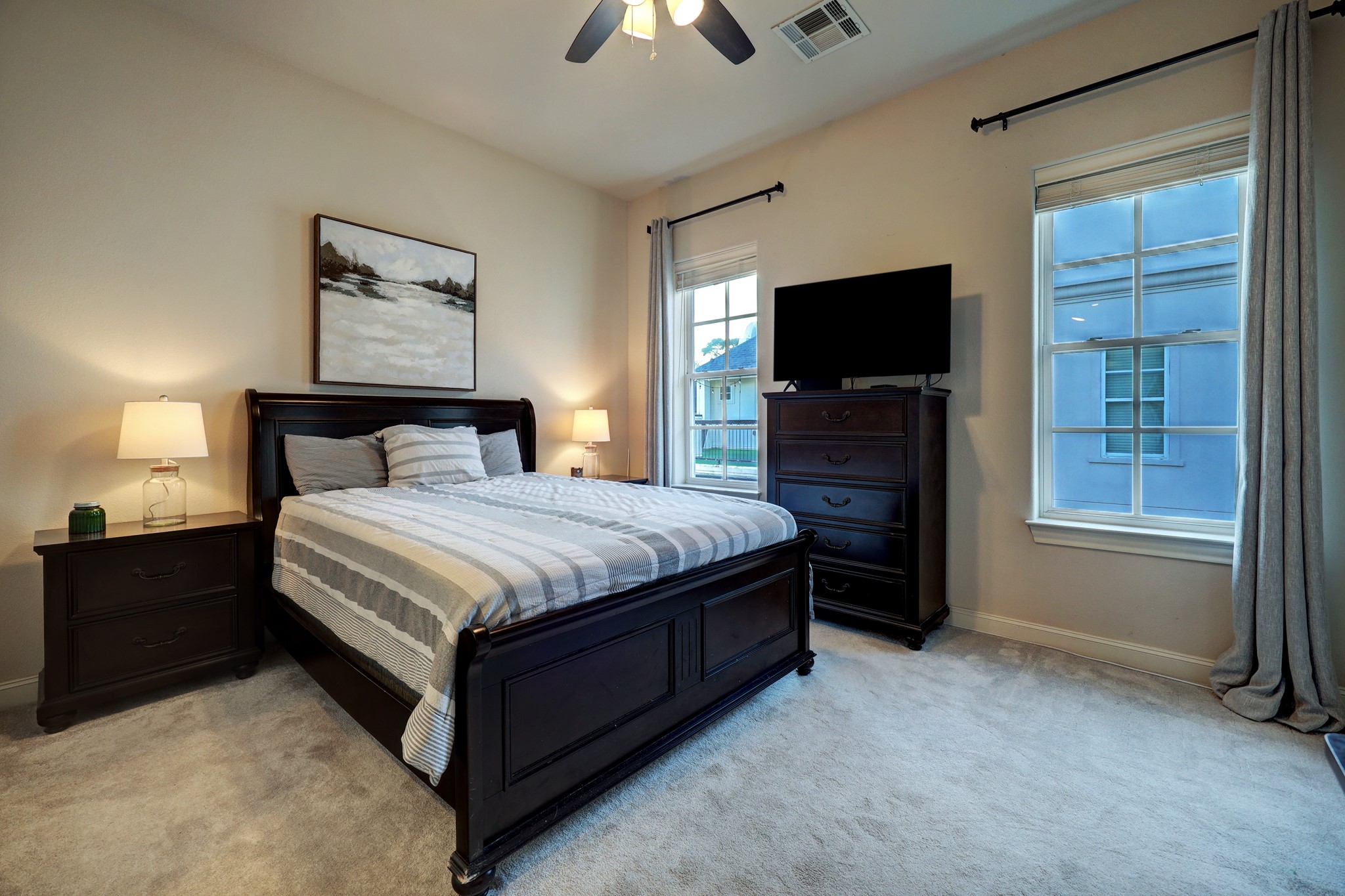 Another lovely bedroom on the third floor with an en-suite bath, a walk-in closet, and ample natural light.