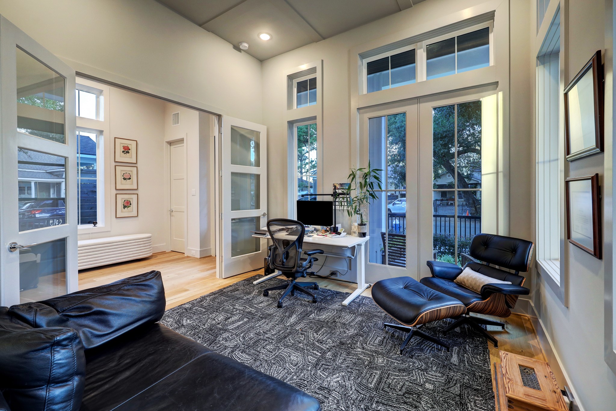 Off the entry, French doors open to a large study with floor-to-ceiling windows, a walk-in closet and direct access to a semi-private bathroom, making the space ideal as a home office or a fifth bedroom.