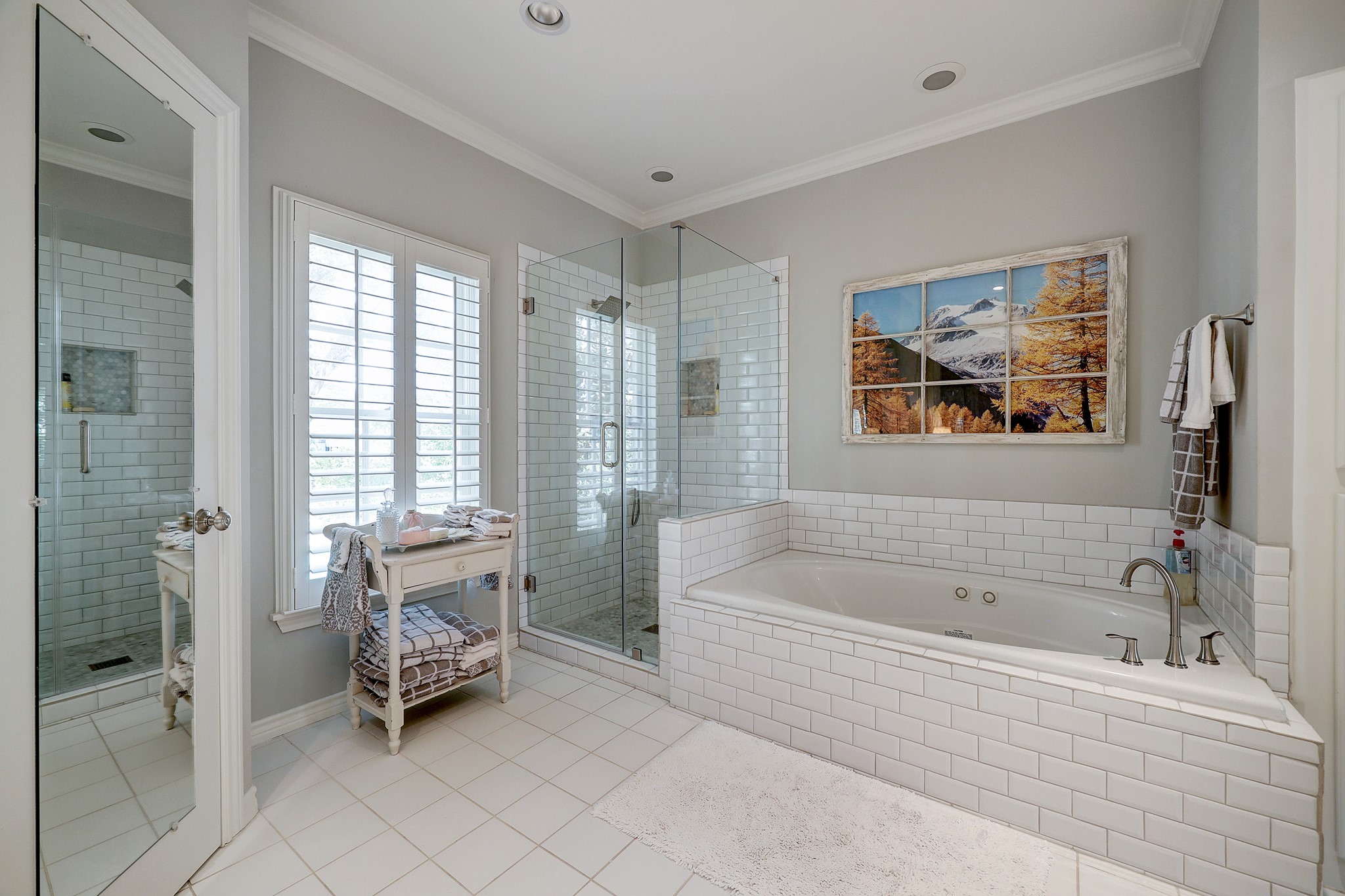The shower and tub tile is fresh and new to create a clean, aesthetic vibe.