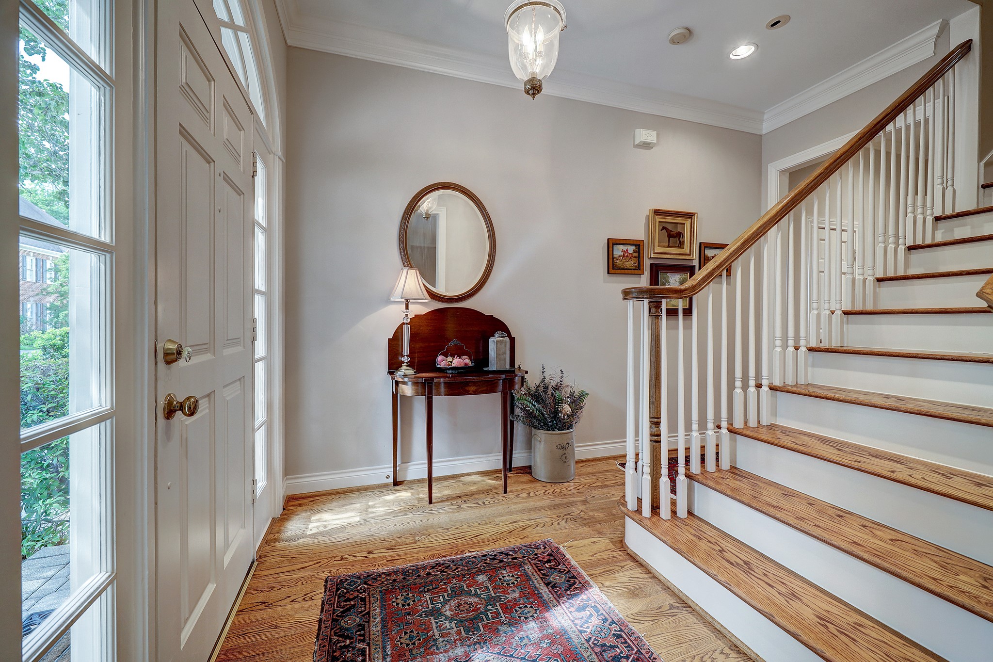 Note the gorgeous hardwood floors, high ceilings and beautiful lighting fixtures.